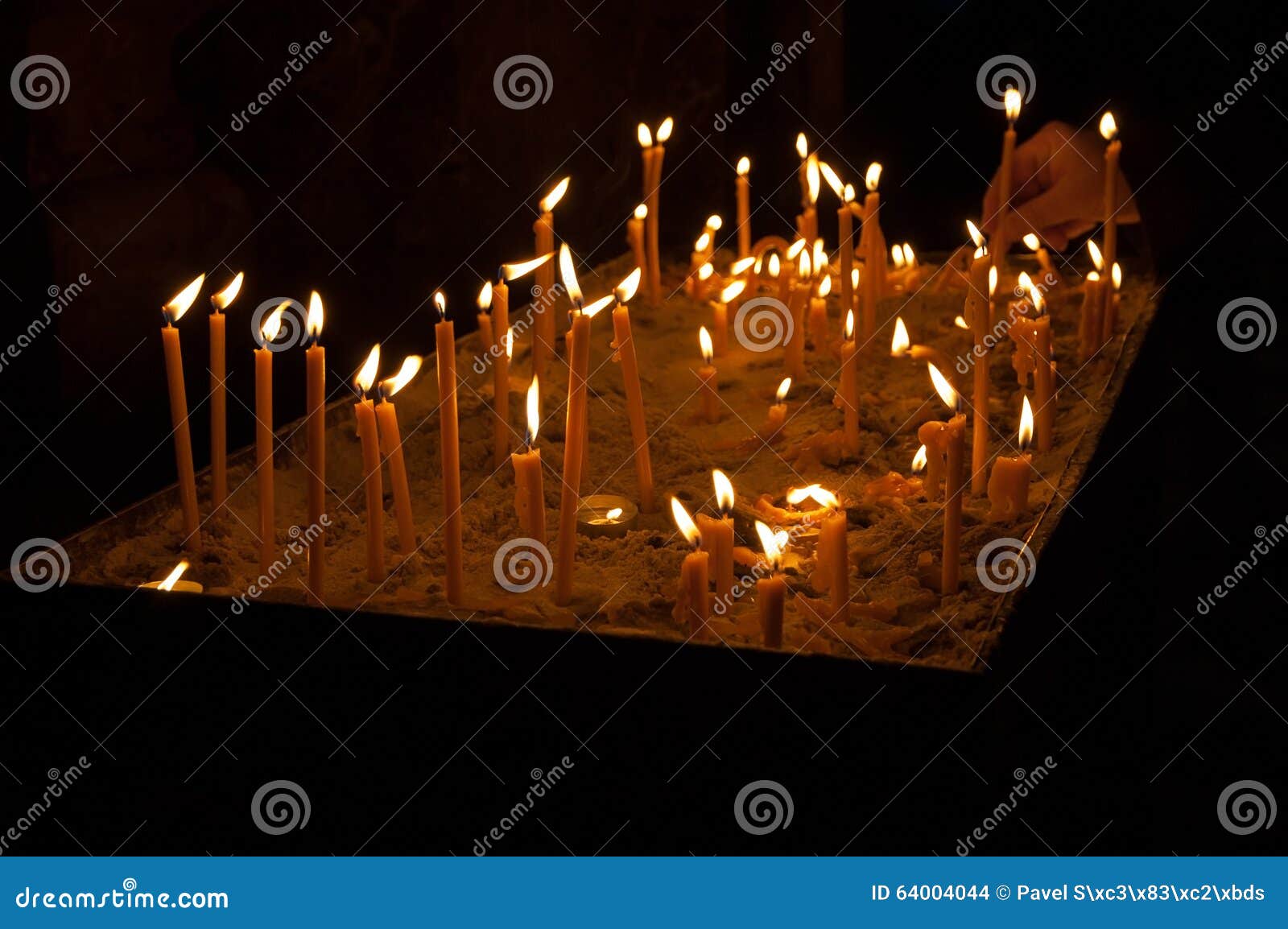 Lighted candles in church stock photo. Image of catholic 64004044