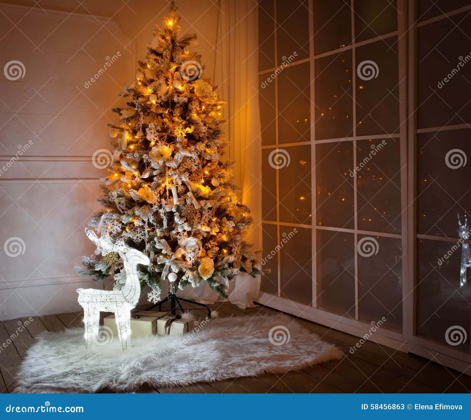 A Lighted Christmas Tree with Presents Underneath Stock Image Image