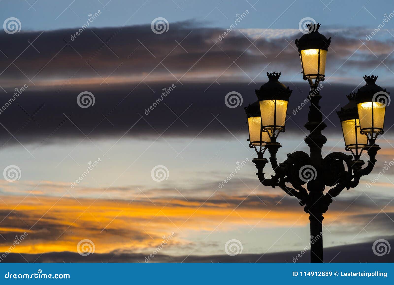 Lighted Lanterns Against the Backdrop of the Setting Sun on the Streets