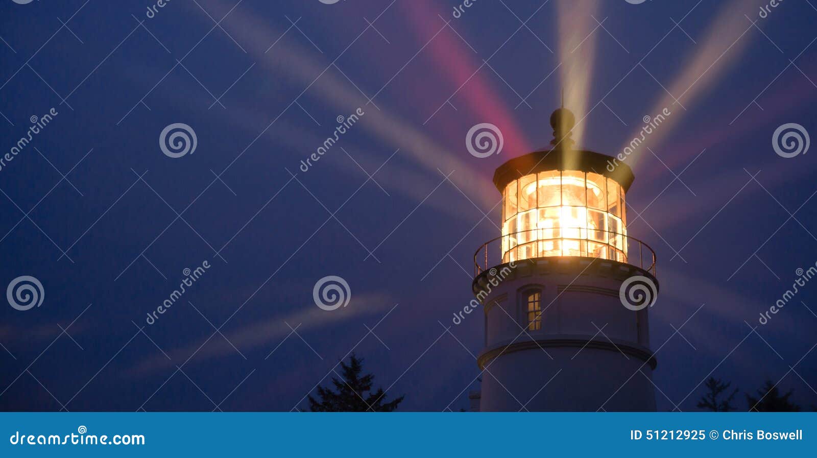 lighthouse beams illumination into rain storm maritime nautical