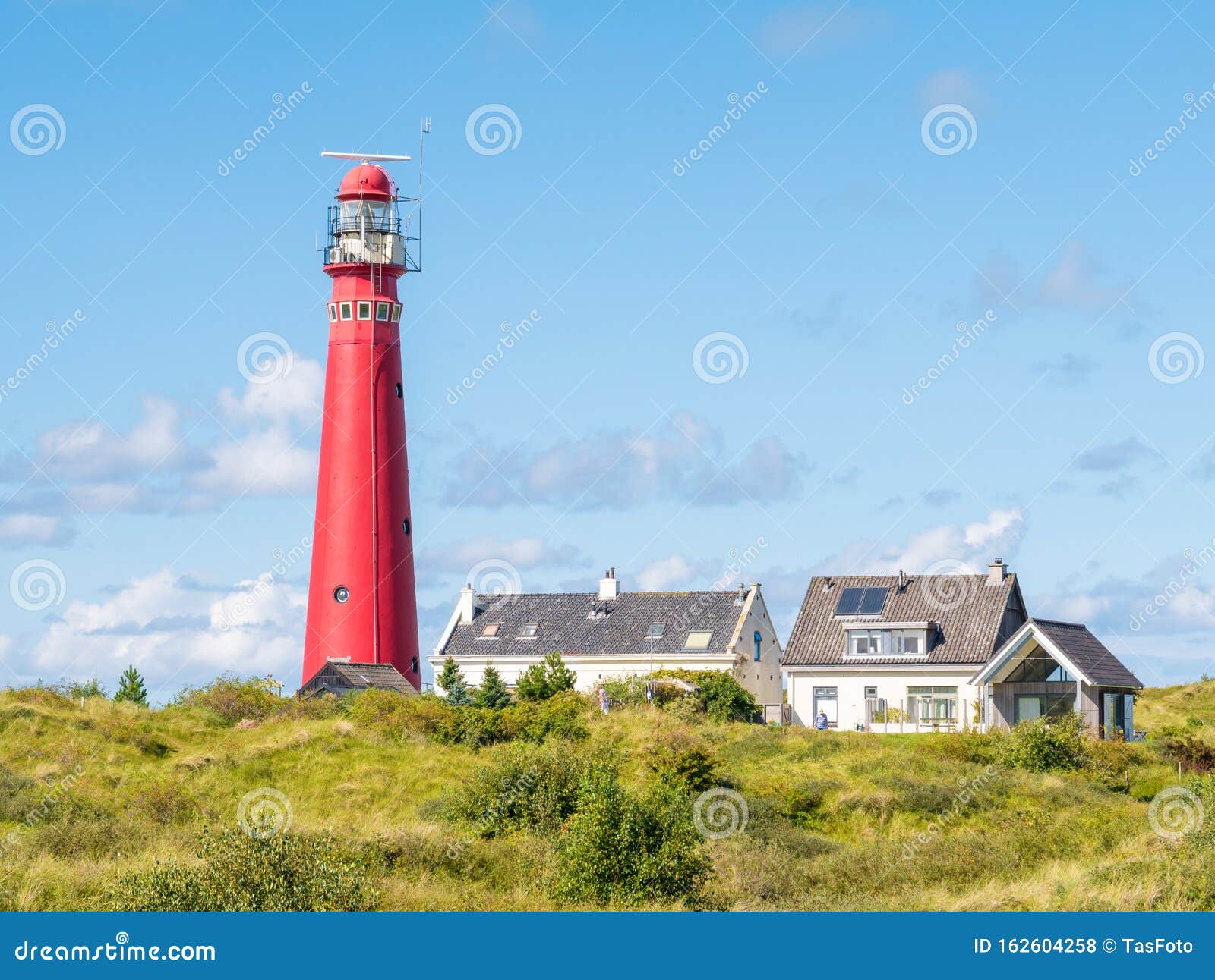 lighthouse in dunes of schiermonnikoog, west-frisian island, netherlands