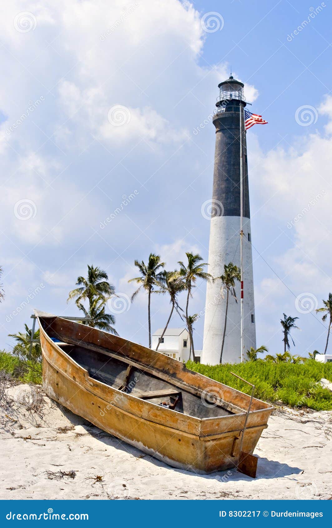 Lighthouse, flag and boat stock image. Image of flagpole 
