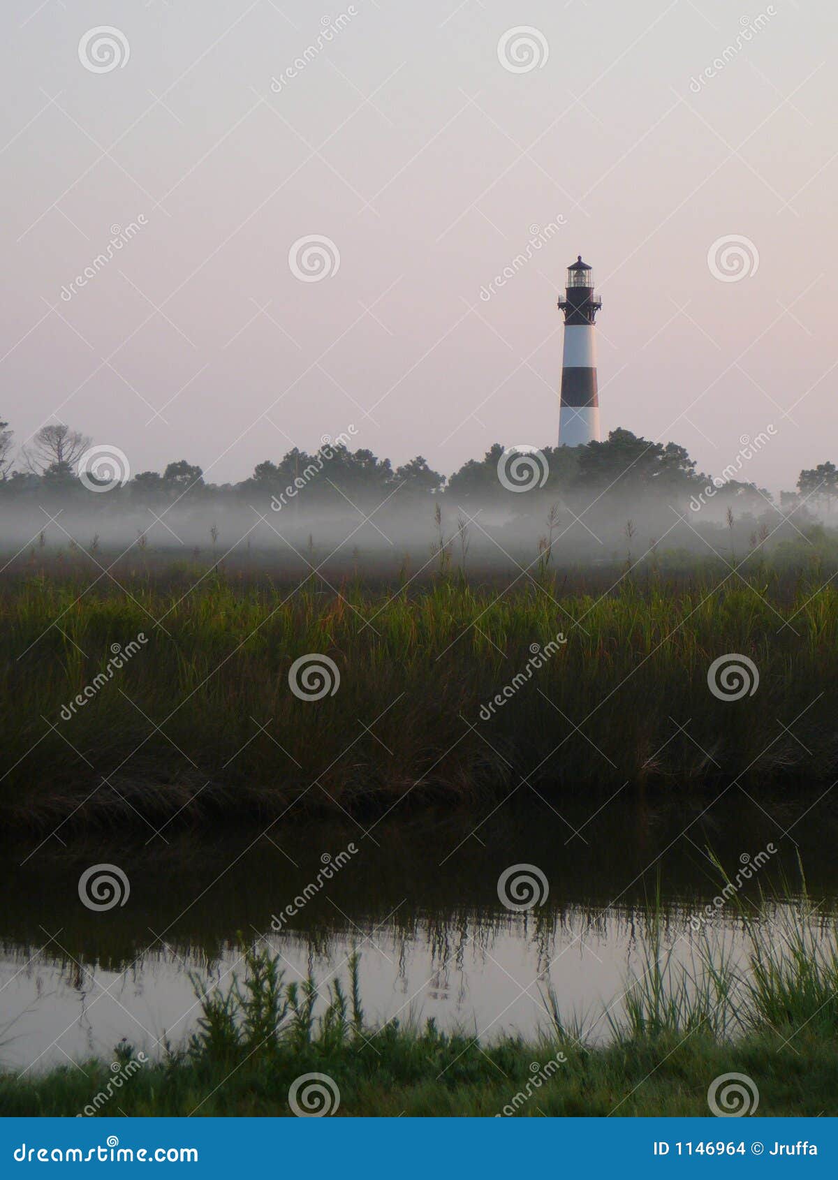 lighthouse in the morning mist