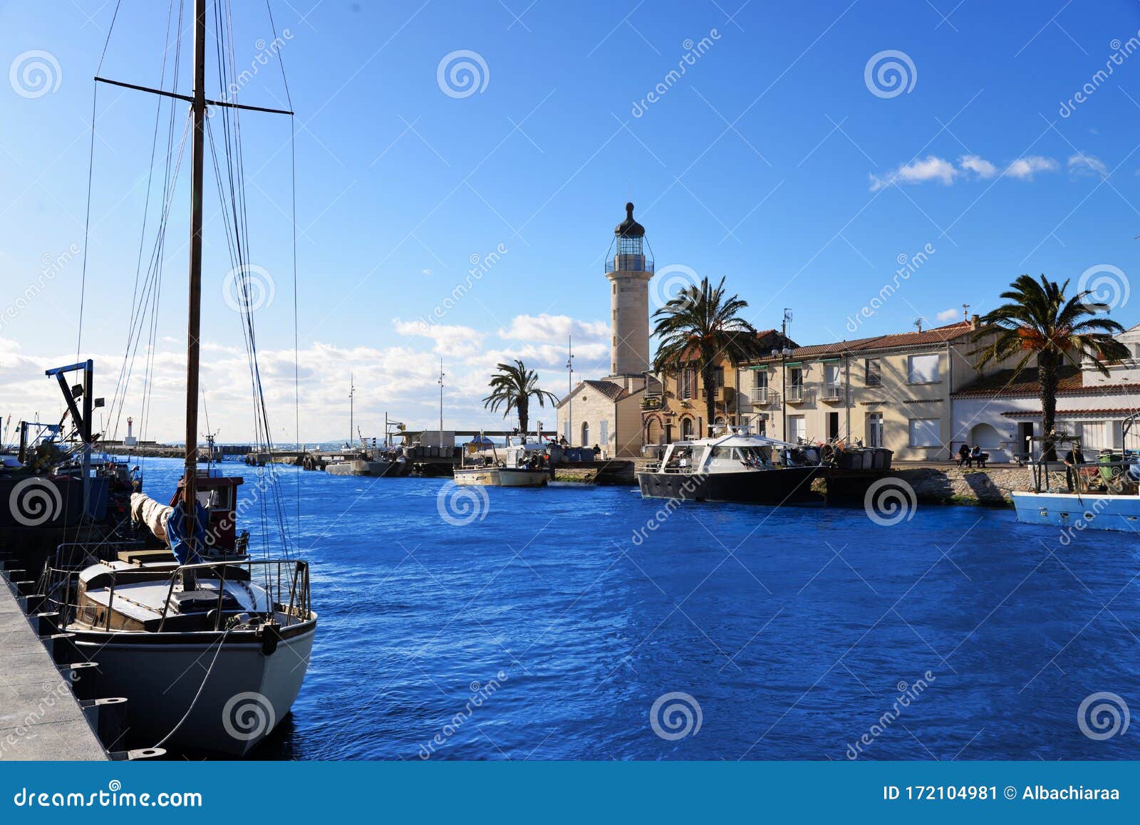 lighthouse and old fishing port of grau du roi in camargue zoological nature reserve. south of france.
