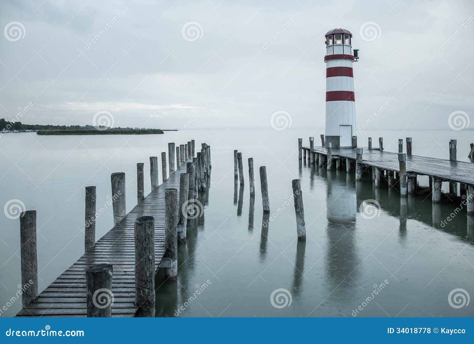 Lighthouse in the rain stock photo. Image of neusiedl 34018778
