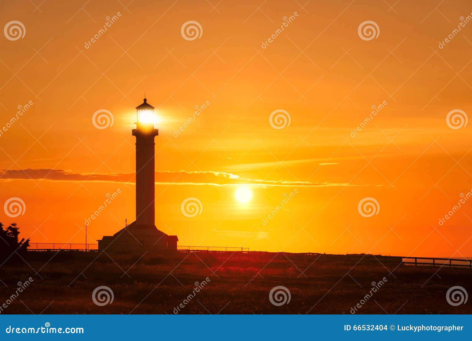 Lighthouse Searchlight Beam At Sunset Stock Photo - Image: 66532404
