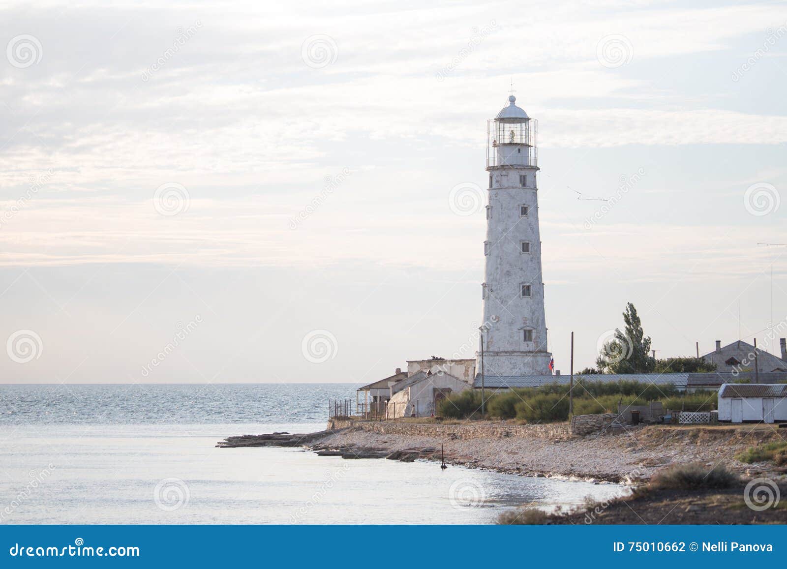 Lighthouse Stands on the Beach Stock Photo Image of white, back 75010662