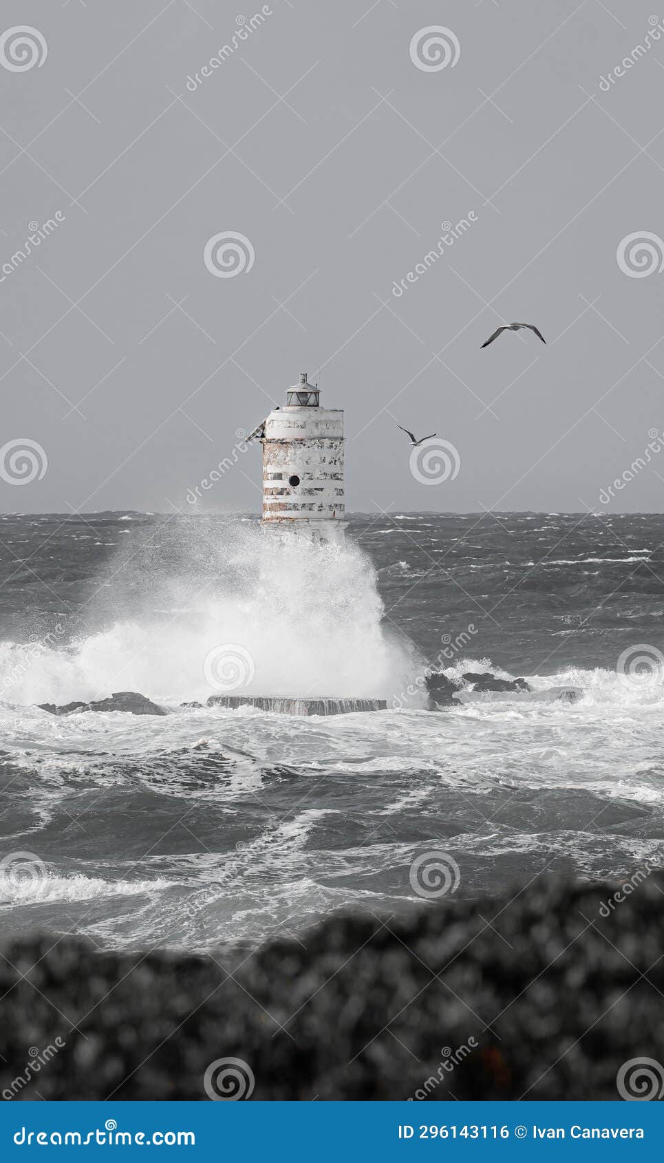 lighthouse storm - mangiabarche lighthouse during a winter swell