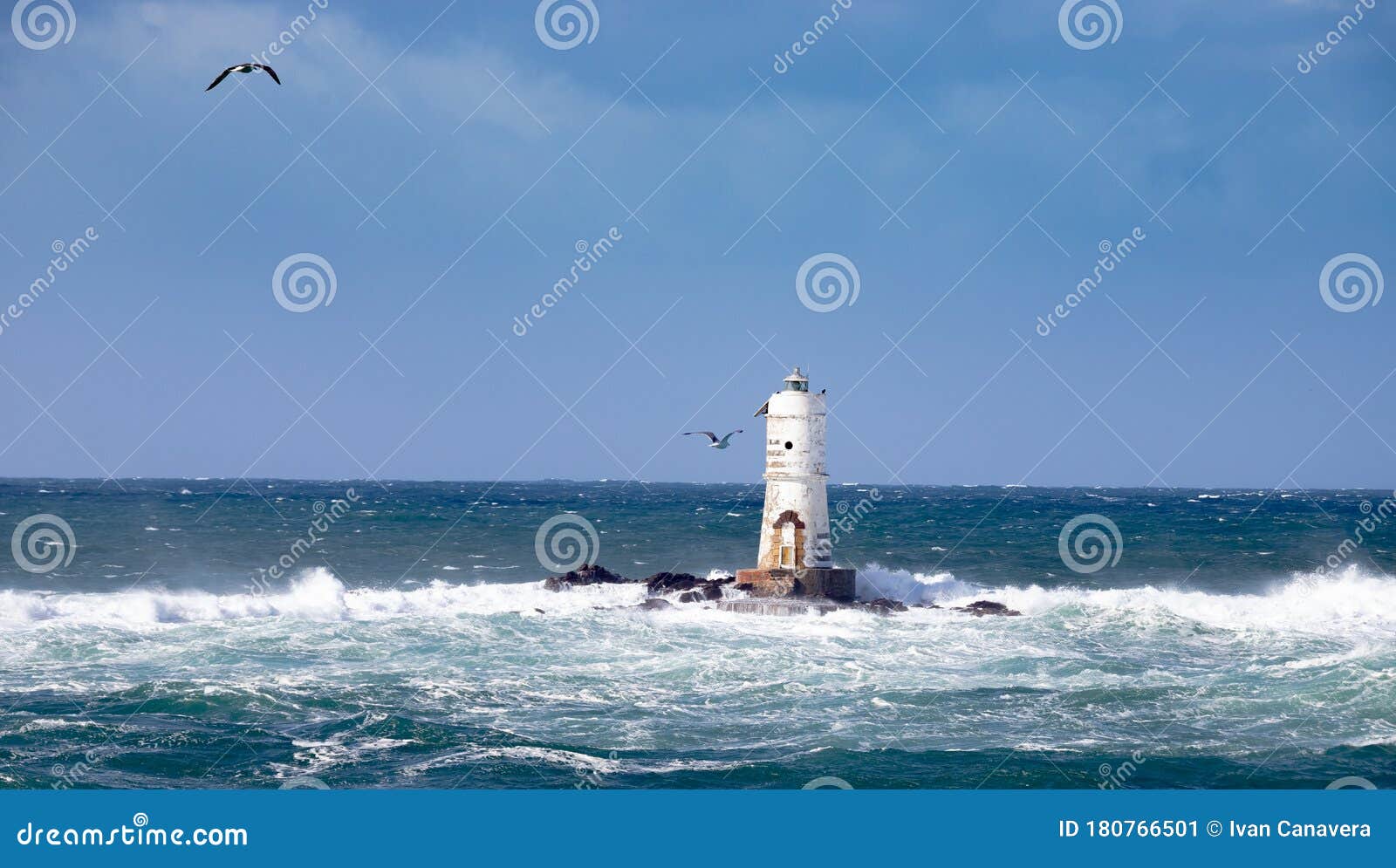 the lighthouse of the mangiabarche shrouded by the waves of a mistral wind storm