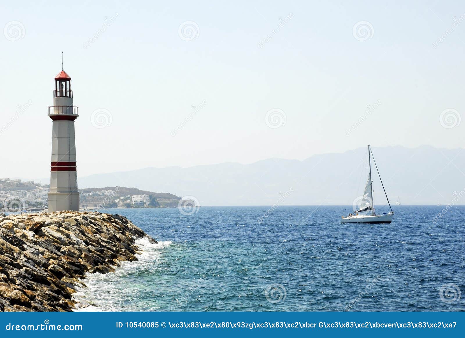 Lighthouse and Yacht stock image. Image of boat, sail 10540085