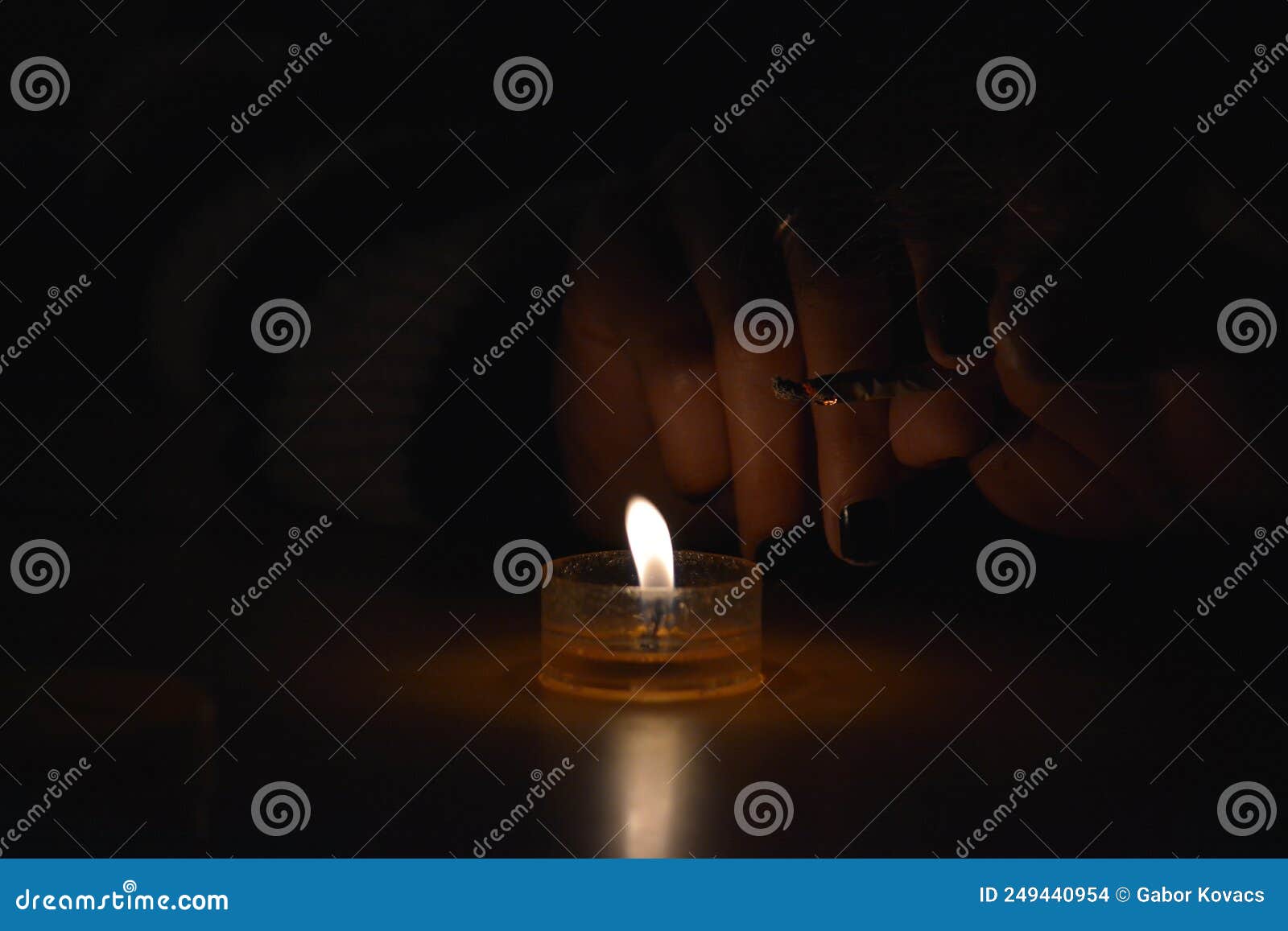 Lighting a Cigarette with a Candle Stock Photo Image of glass