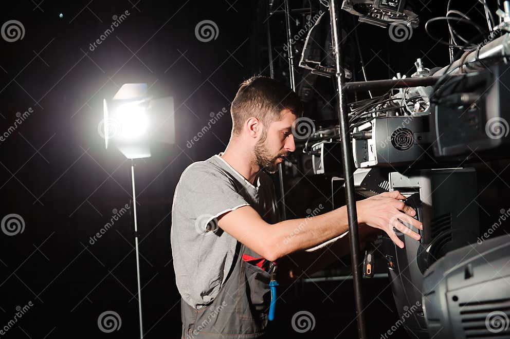 The Lighting Engineer Adjusts the Lights on the Stage. Stock Image