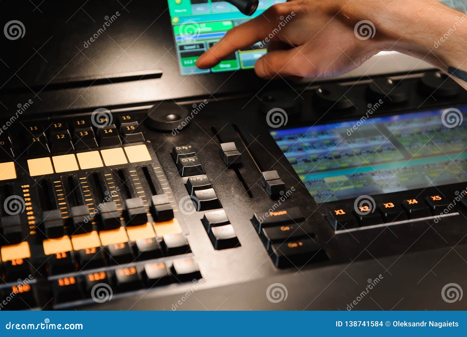 A Lighting Engineer Works with Lights Technicians Control Stock Photo