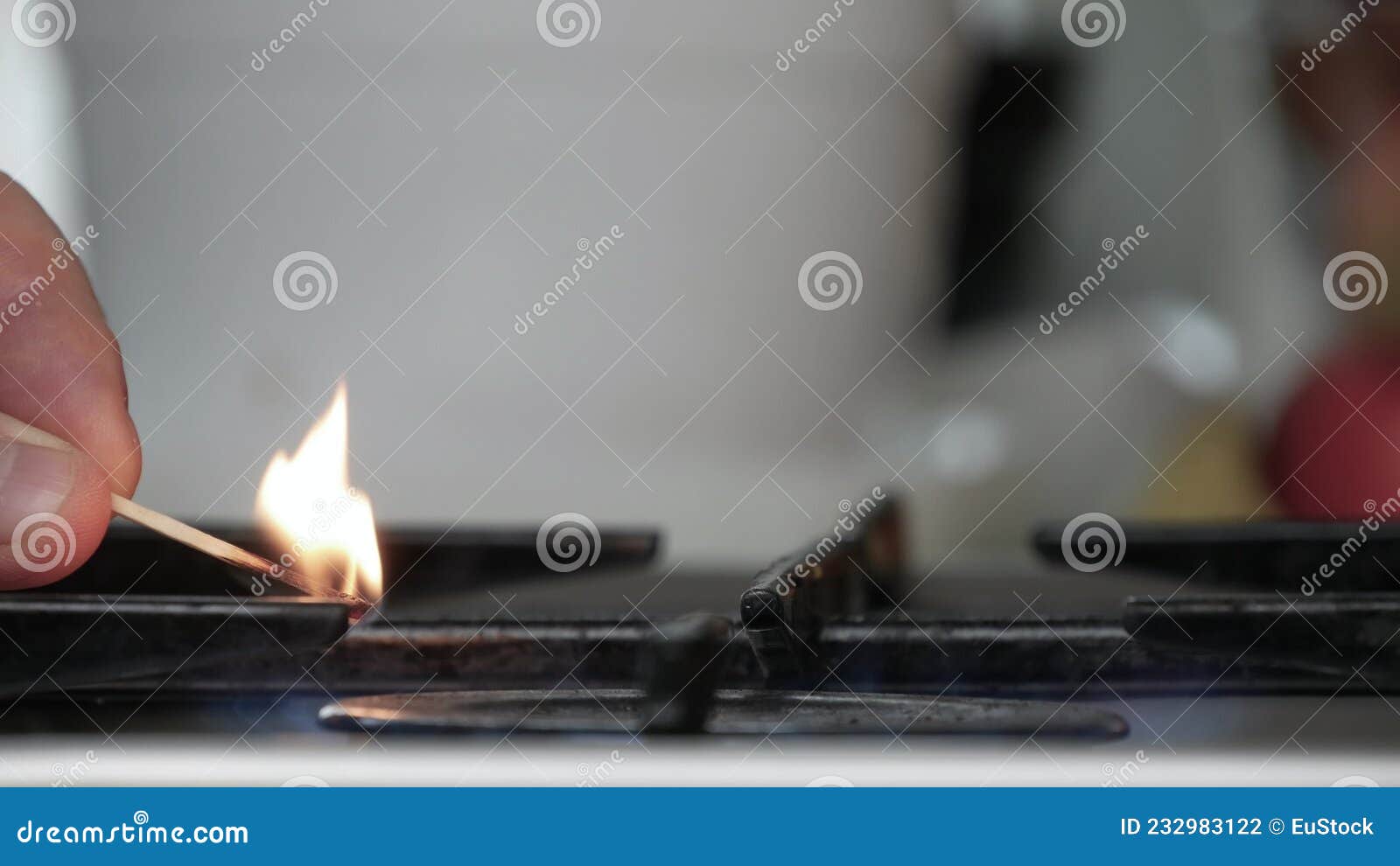 Lighting the Flame of the Kitchen Stove Opening the Gas and Using a Lit