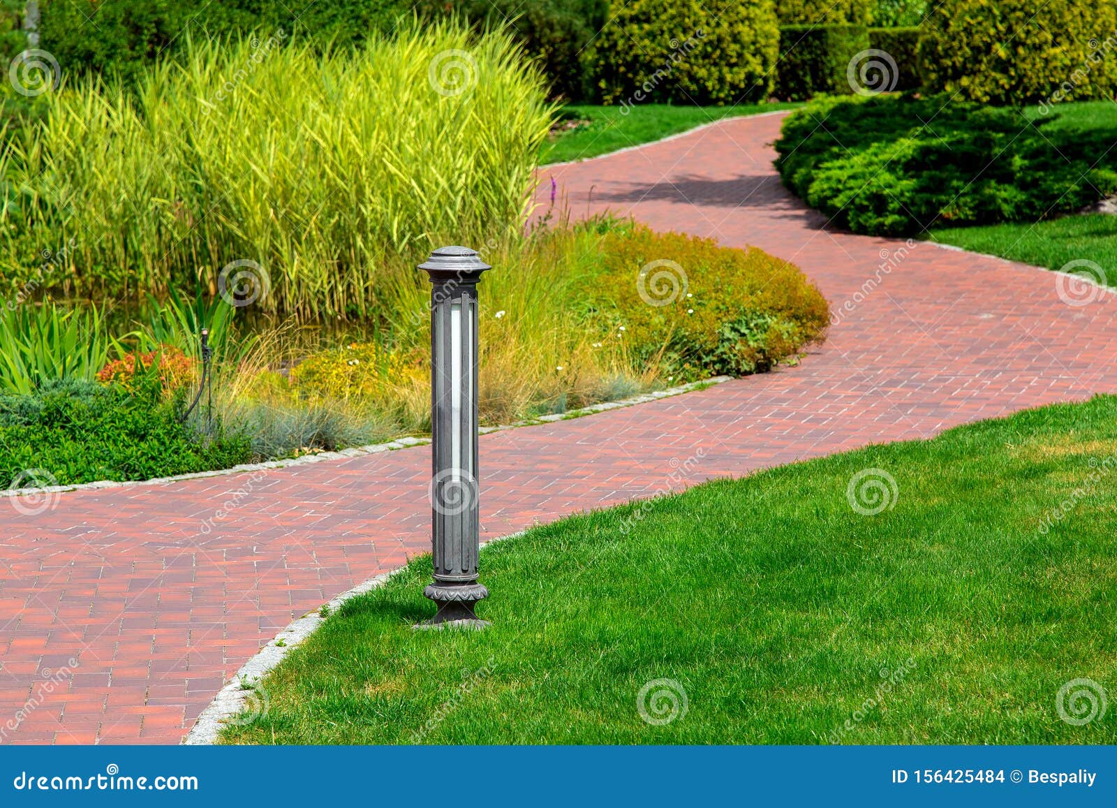 Lighting Ground Lamp Street Mounted on a Green Lawn in a Park. Stock Photo  - Image of friendly, flora: 156425484