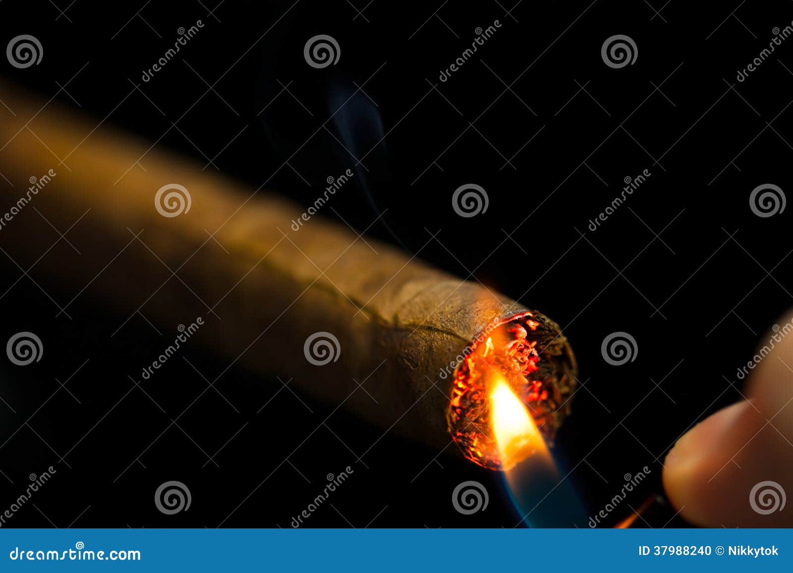 Lighting up a cigar stock photo. Image of cuban, glow 37988240