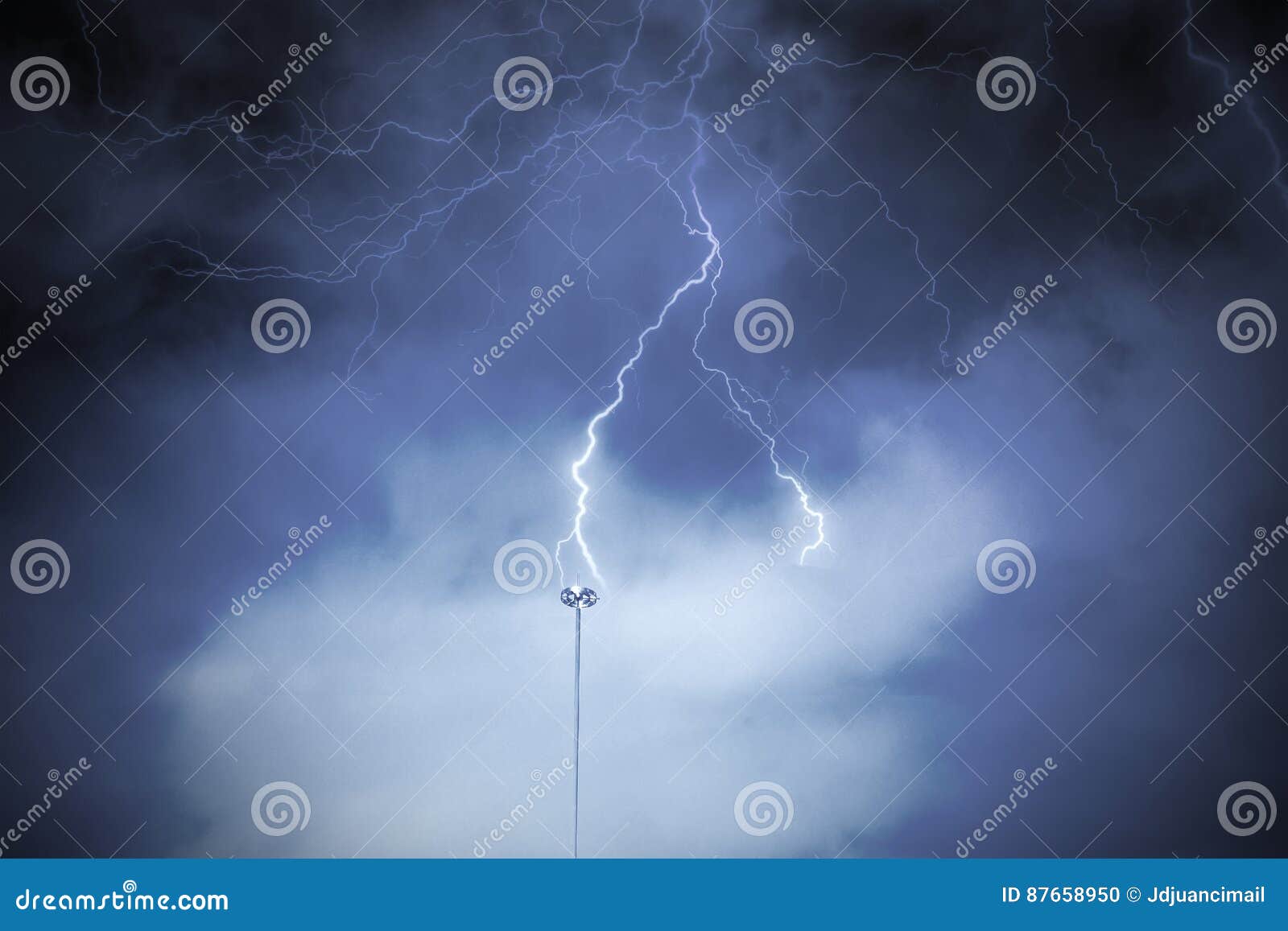 lightning rod against a cloudy dark sky.