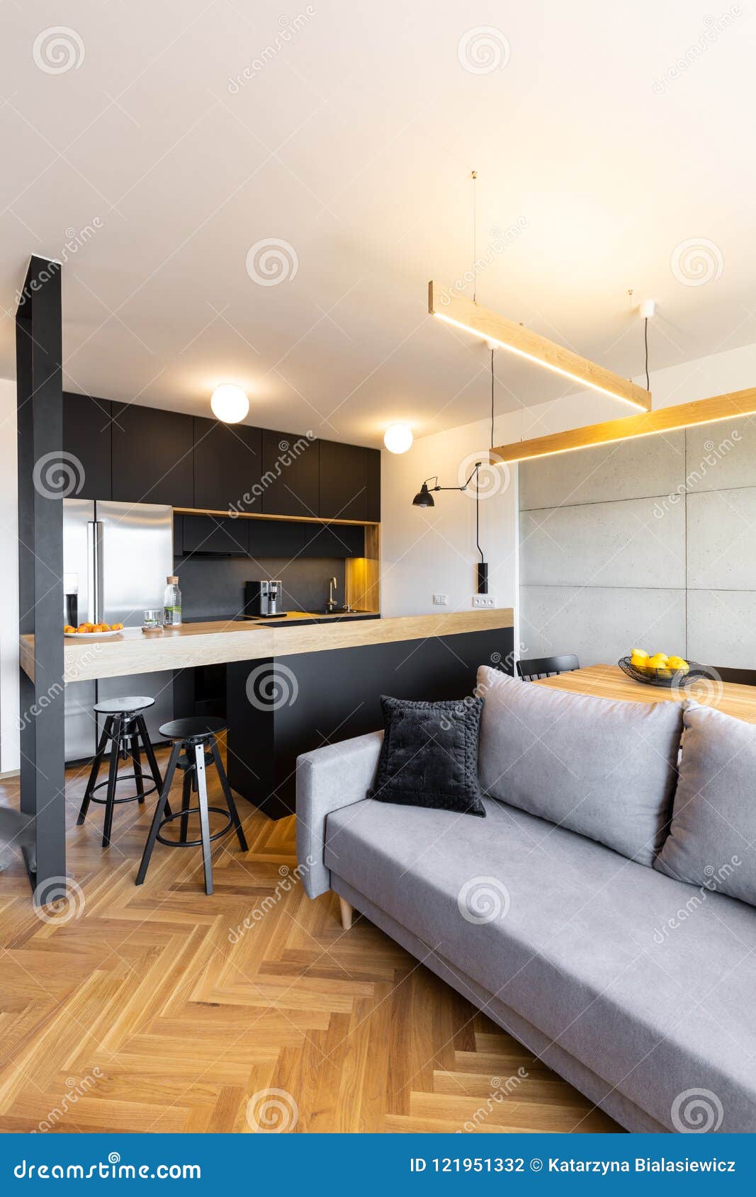Lights Above Countertop In Black Kitchen Interior With Grey Sofa Stock Photo - Image of black ...