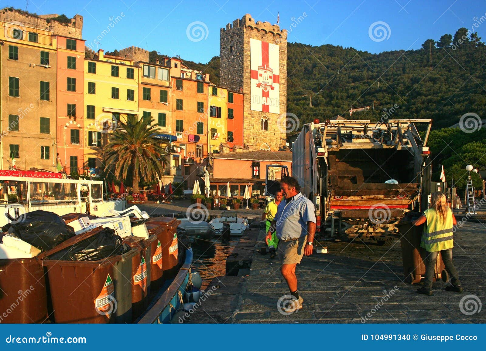 Men working to collect garbage at dawn on the 