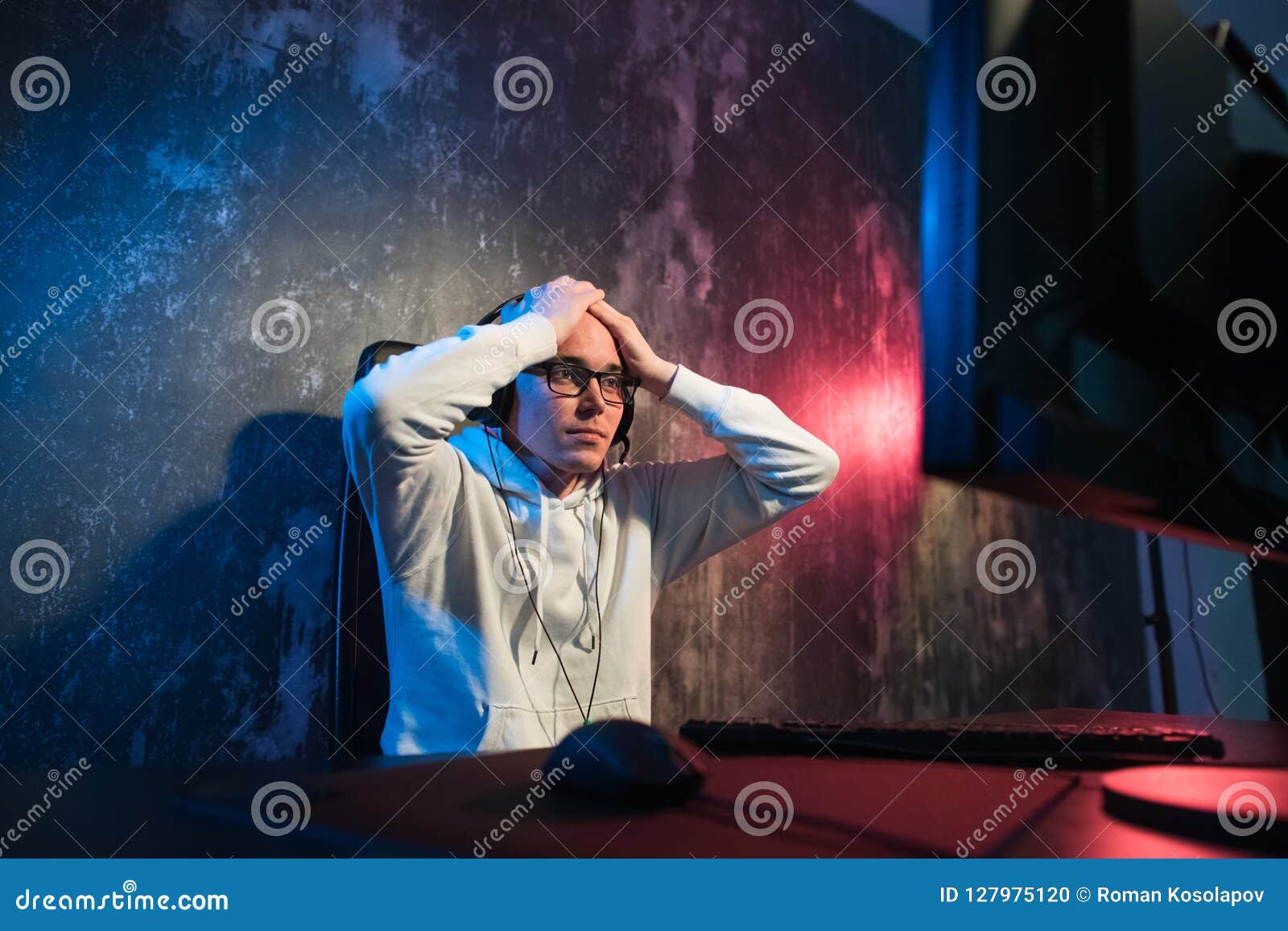 He Like Play and Win Video Games. in Blue Light of Display Emotional