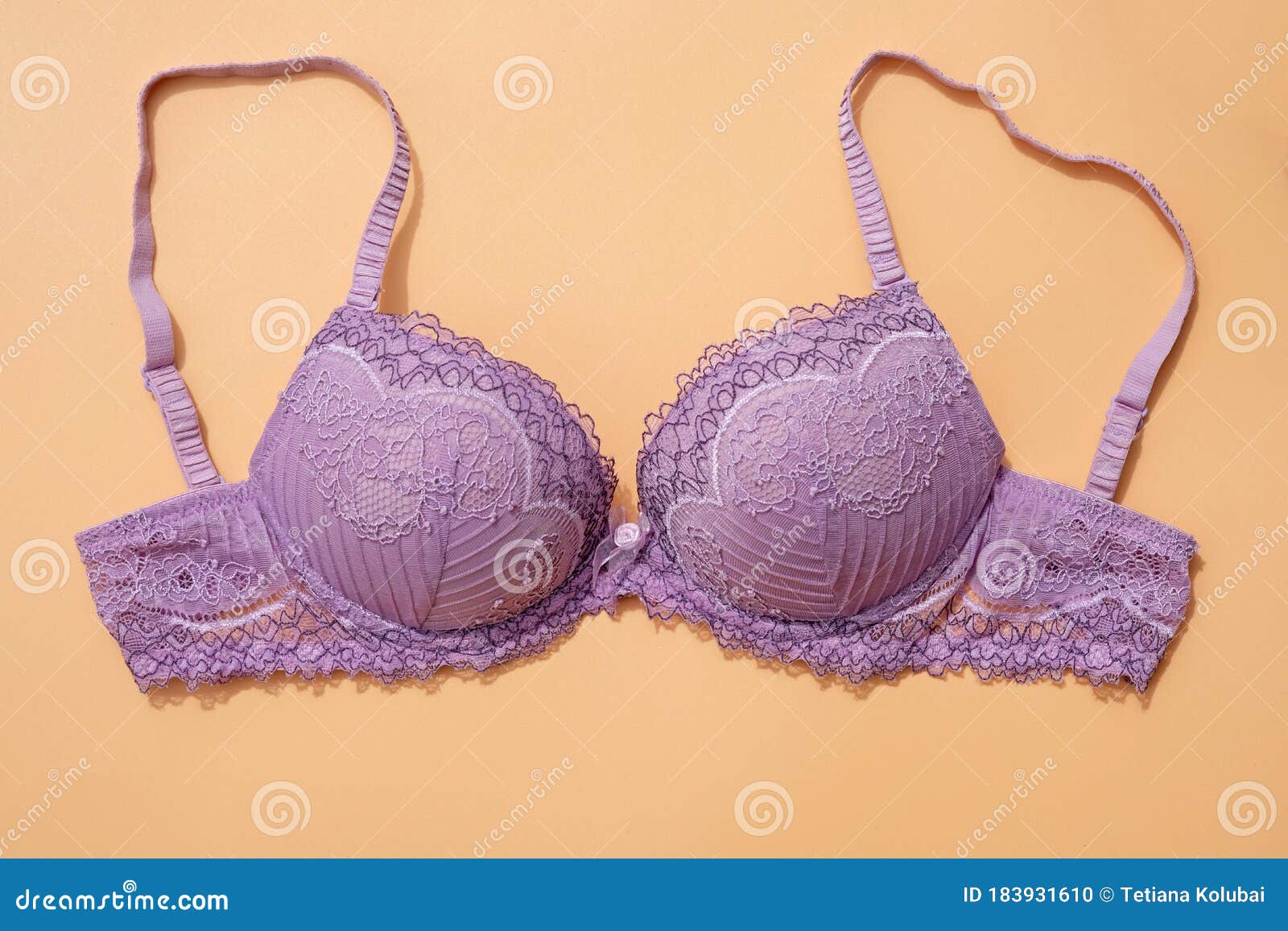 Lilac Bra with Removable Straps on a Beige Background Top View