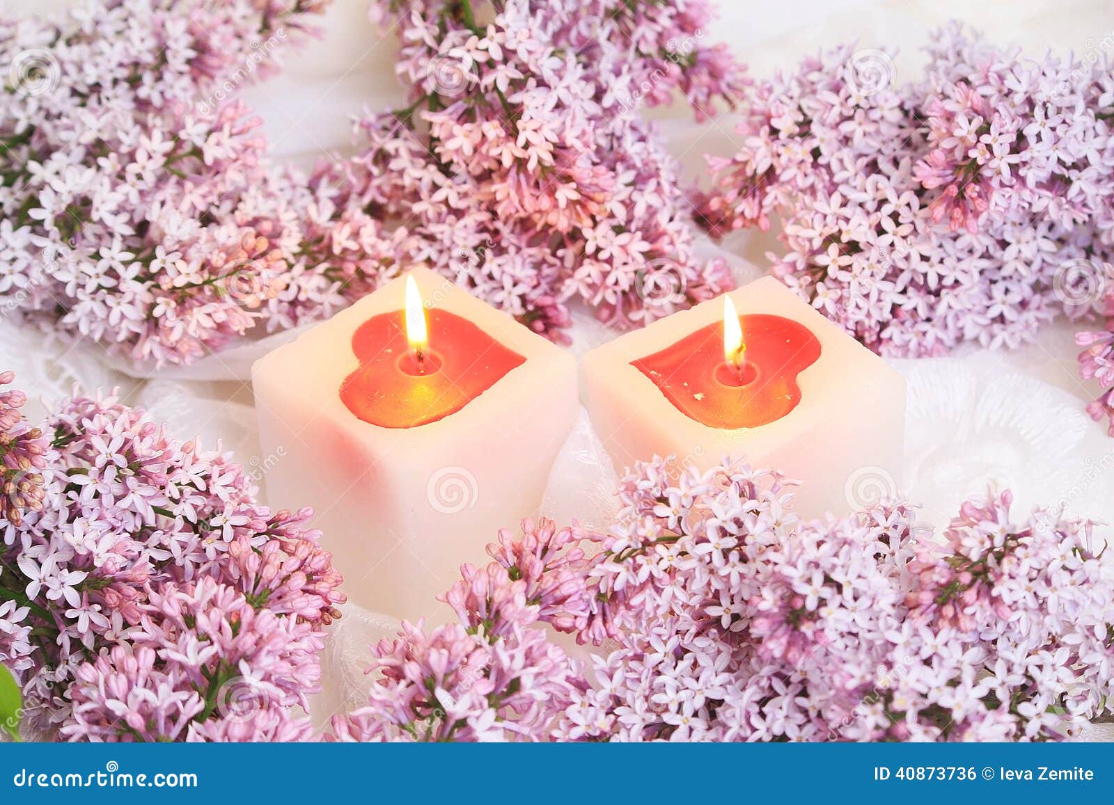 Lilac flowers and candle stock photo. Image of bloom 40873736