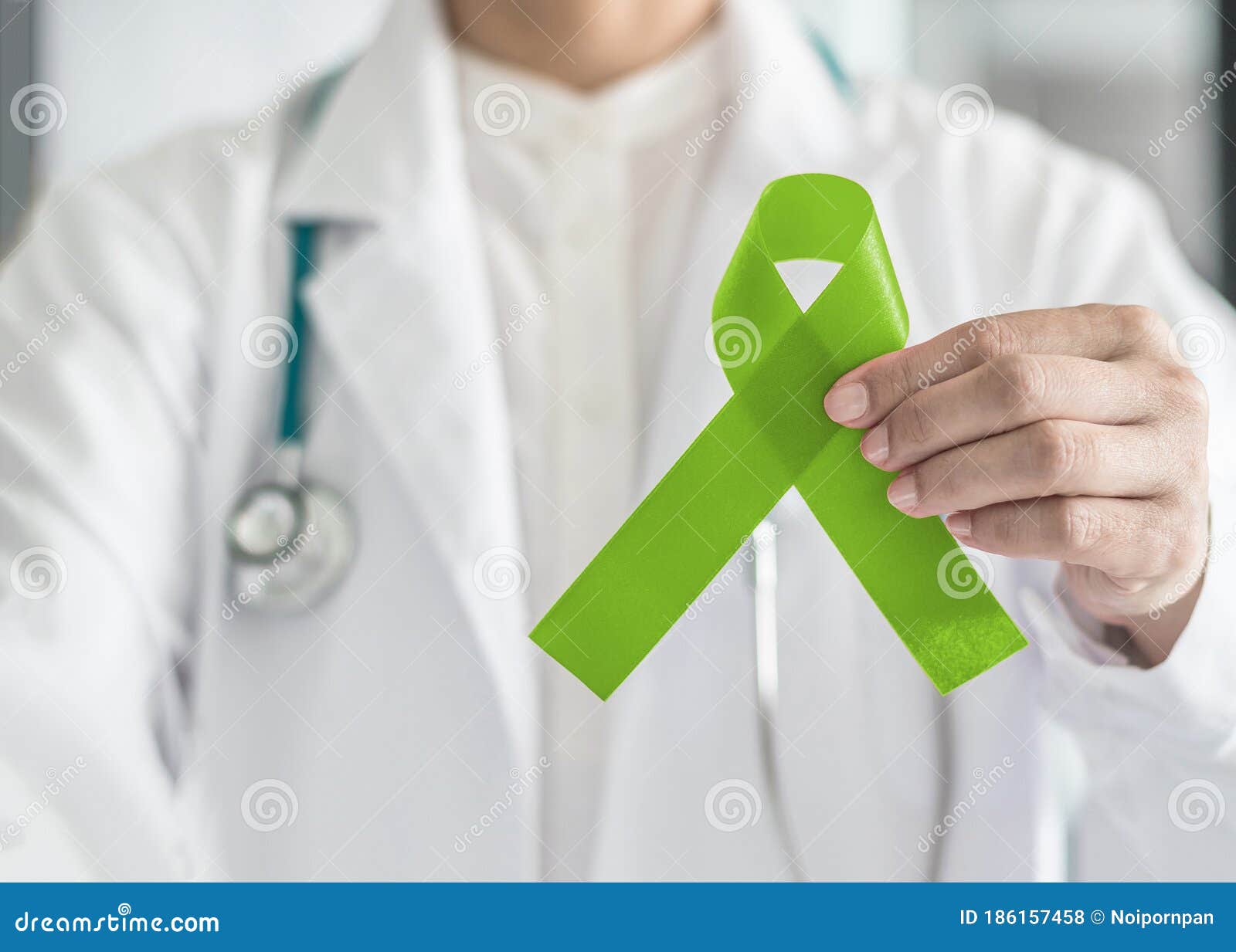 lime green ribbon in doctorÃ¢â¬â¢s hand for lymphoma cancer and mental health awareness, raising support and help patient living