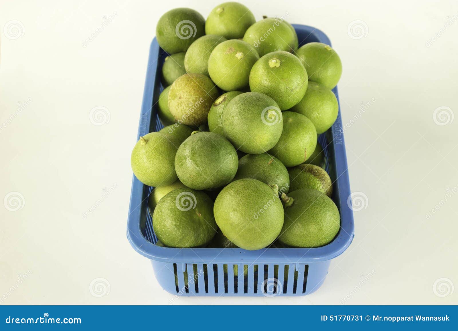 Lime in plastic baskets stock image. Image of cook, garden 51770731