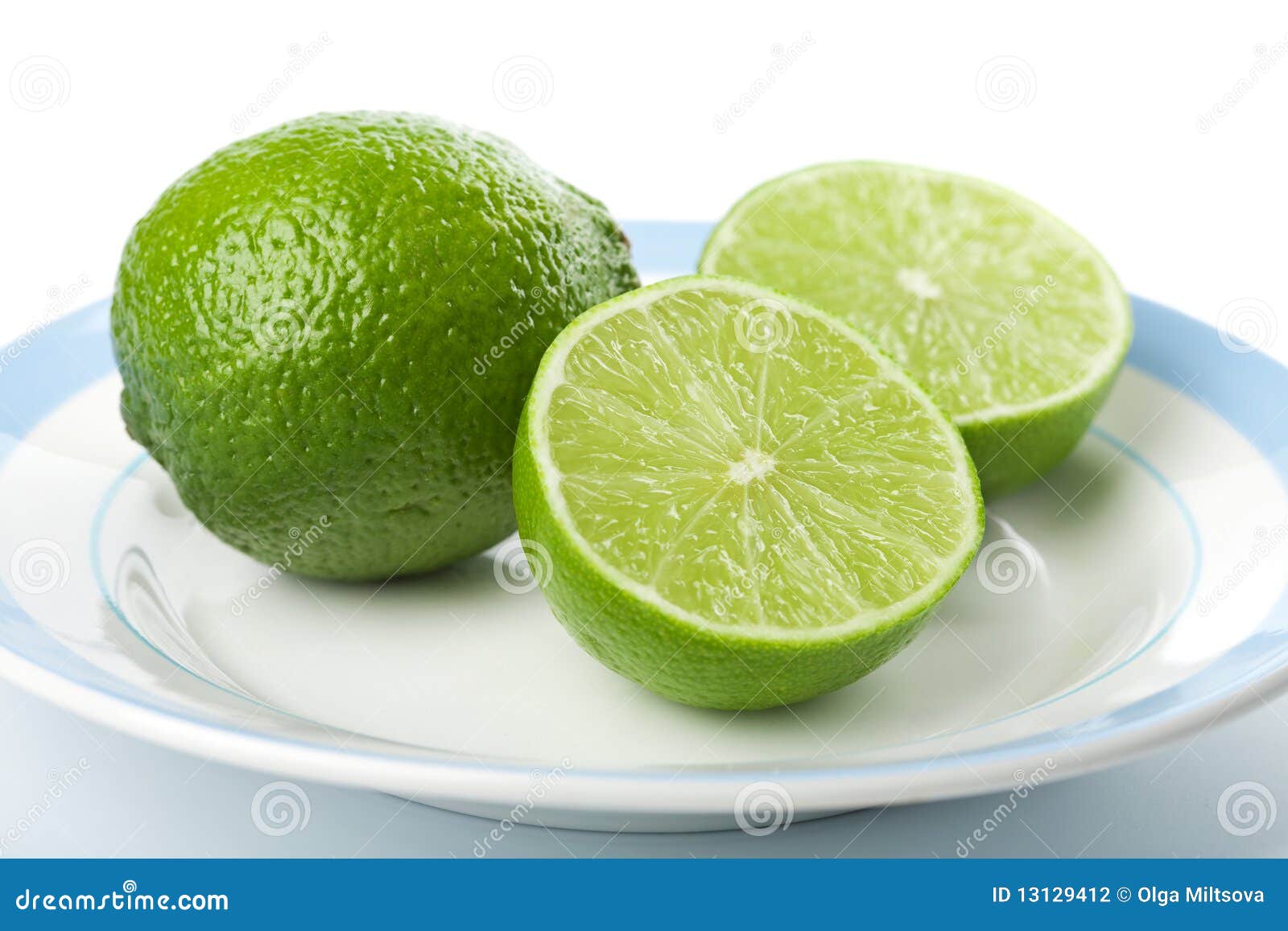 Limes on plate isolated stock photo. Image of liquid 13129412