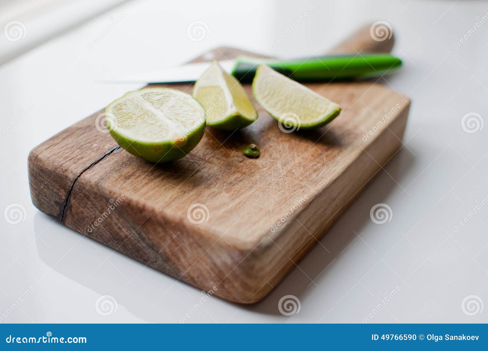 Limes on a Wood Cutting Board Stock Photo Image of cooking, rustic