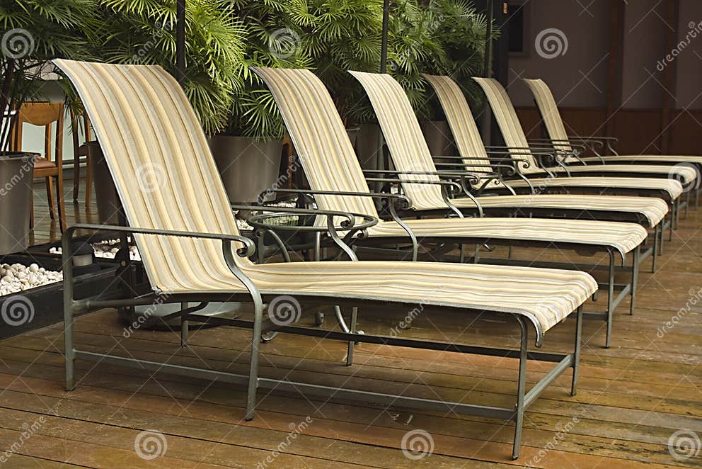 Line of Deck Chairs Around a Pool Area Stock Image Image of chairs