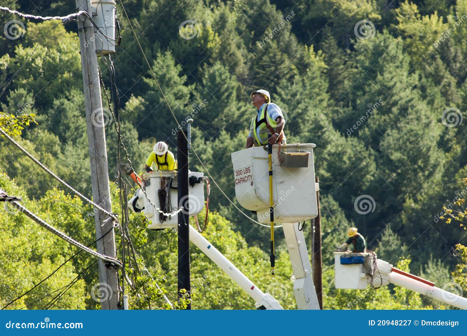 Line Workers Clean Up Damage in Vermont Editorial Photography Image