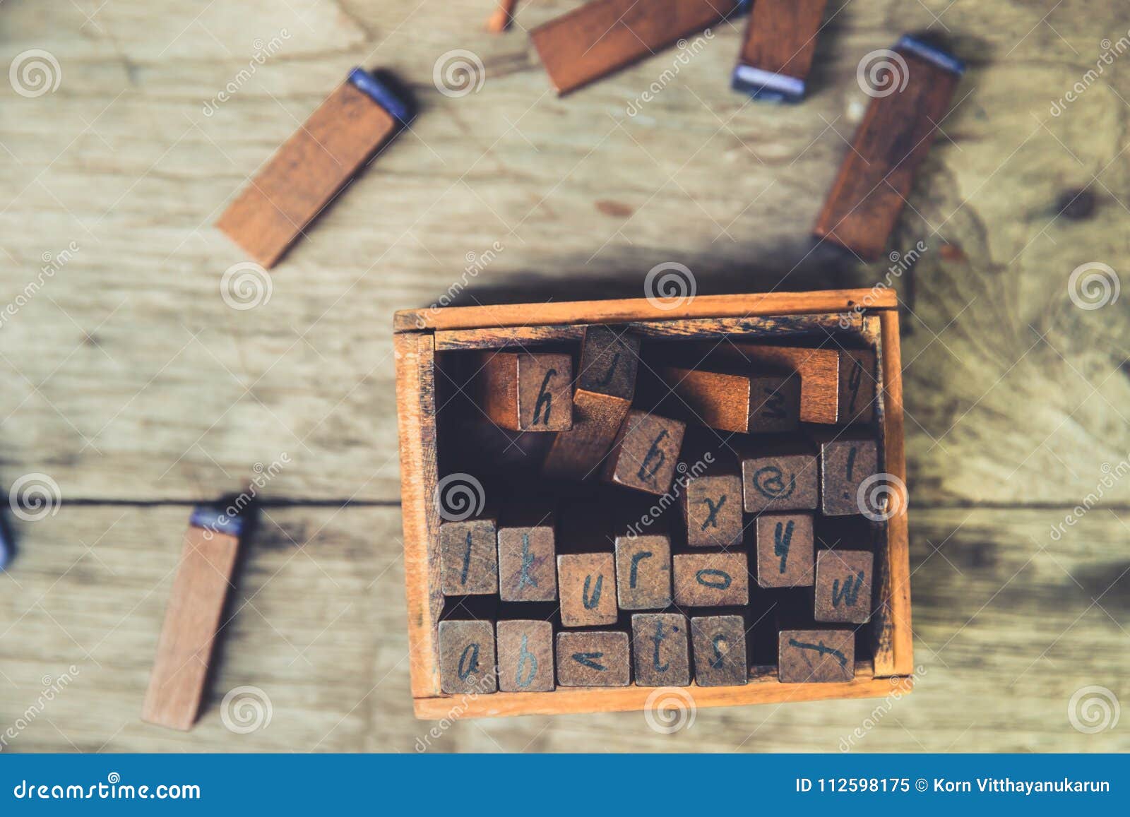 linguistic education concept: wooden text rubber stamp