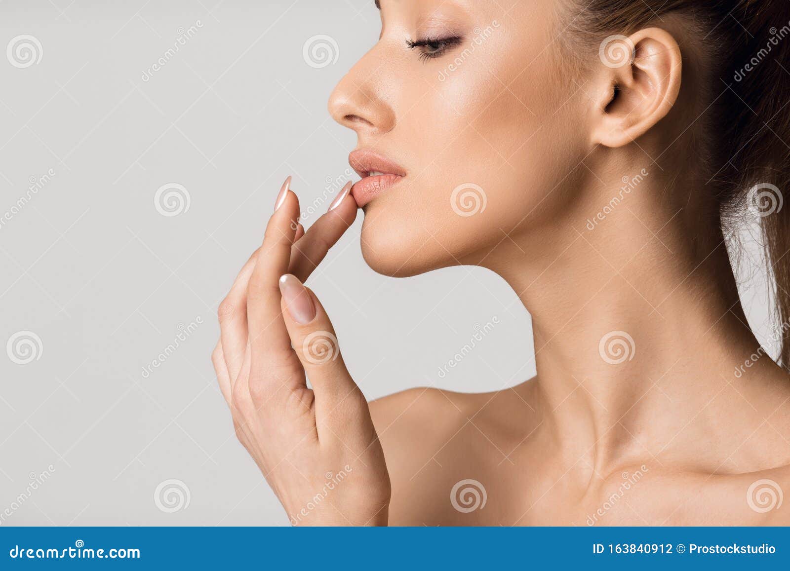 lip augmentation. beautiful girl touching her lips