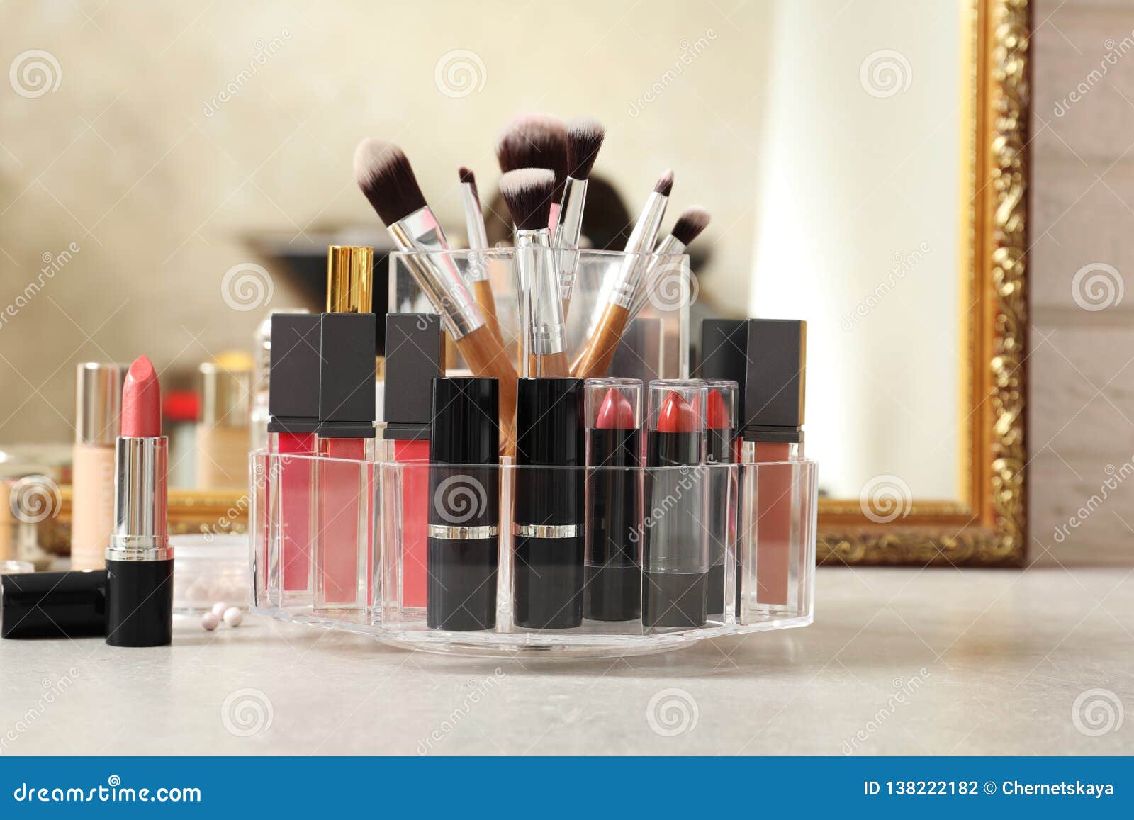 Lipstick Holder with Different Makeup Products on Dressing Table Stock