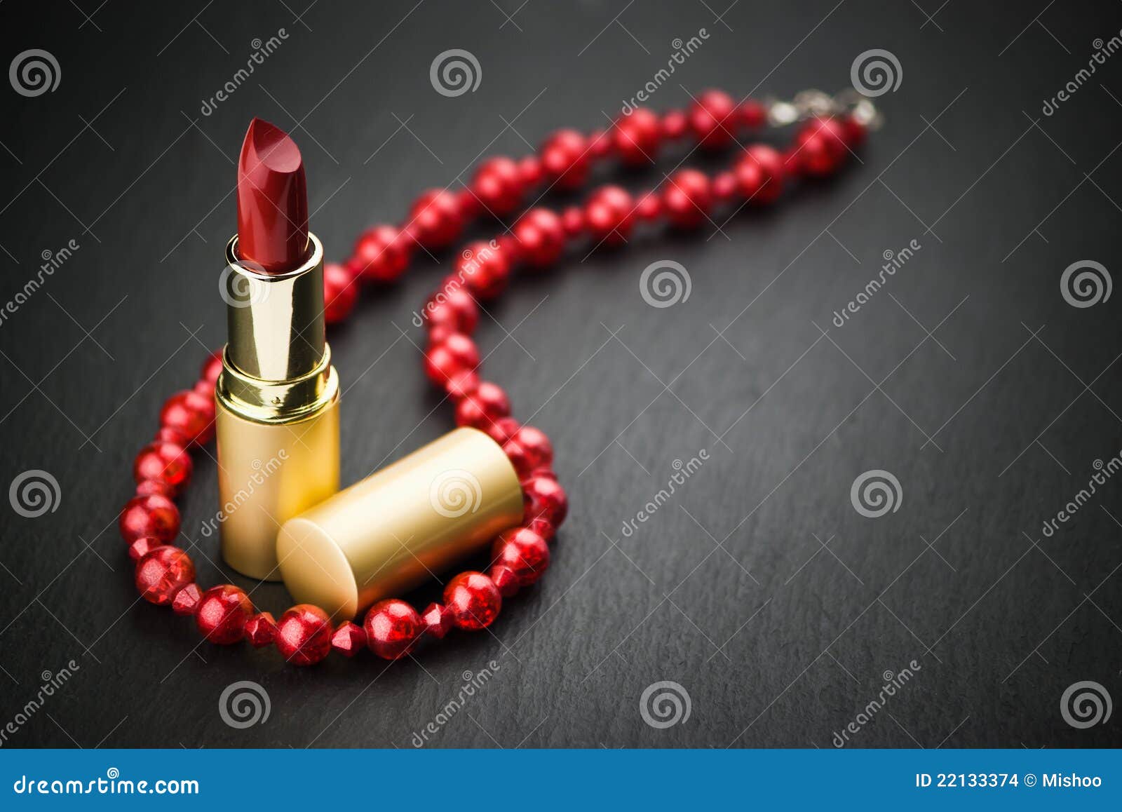 Lipstick and red necklace stock photo. Image of elegance 22133374