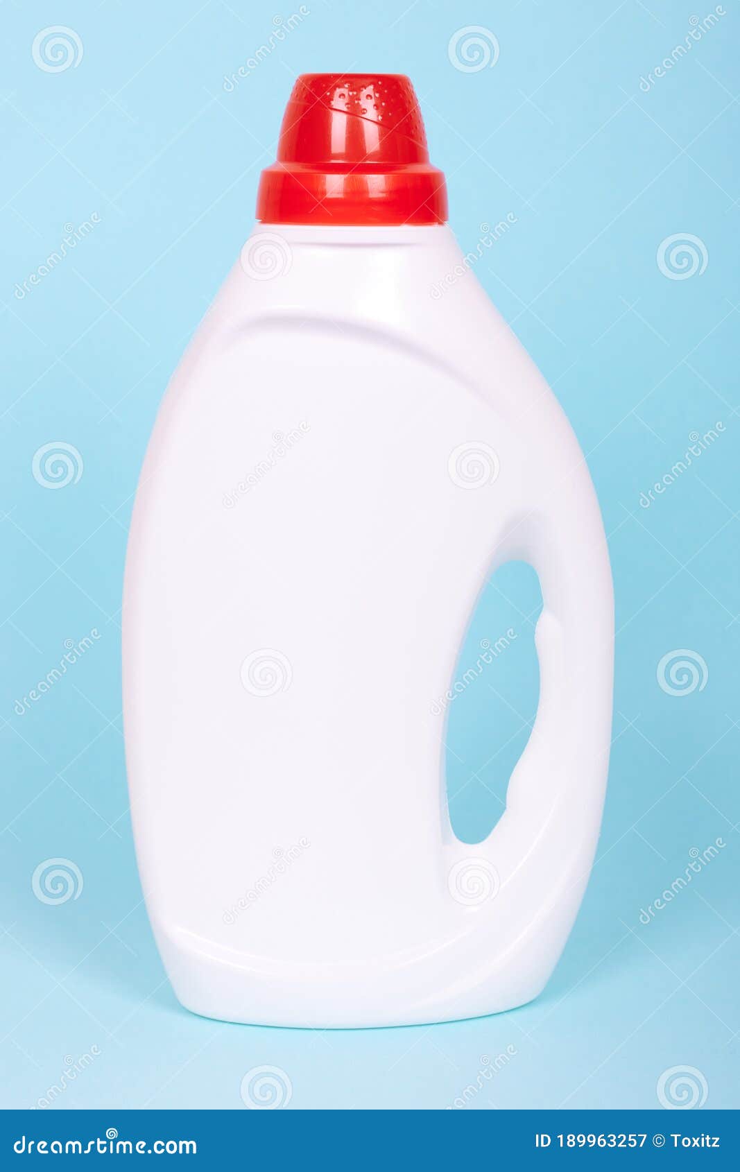 Liquid Detergent in Plastic Bottle. Isolated on Blue Background Stock