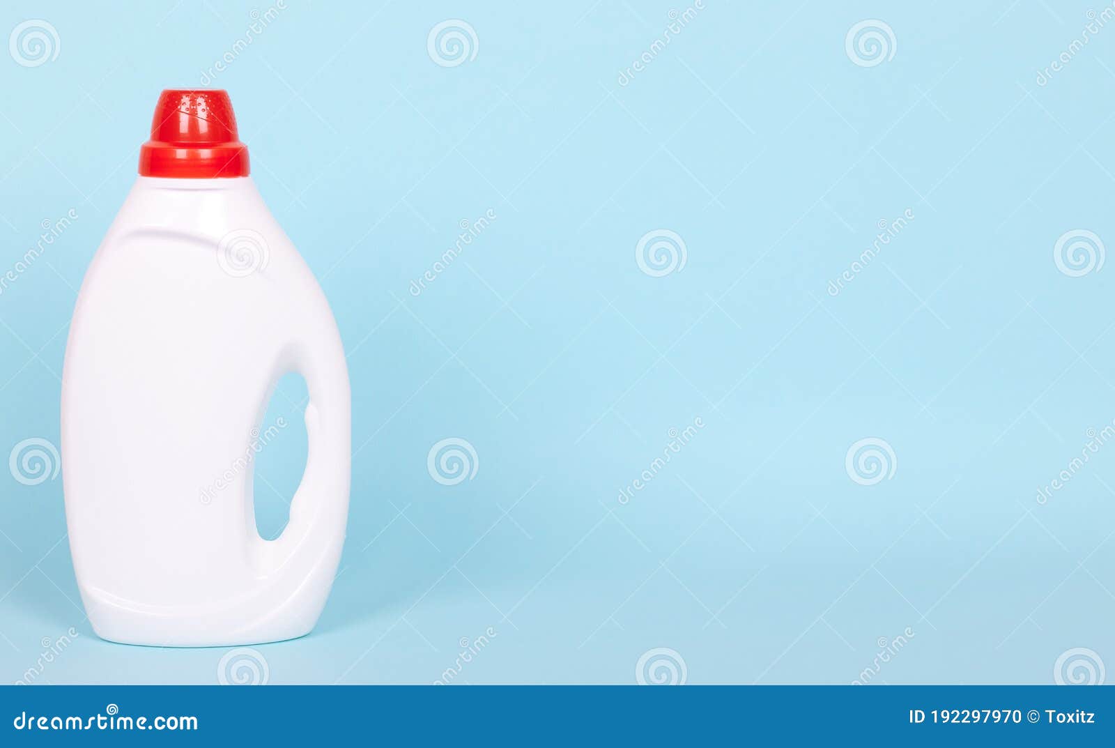 Liquid Detergent in Plastic Bottle. Isolated on Blue Background. Copy