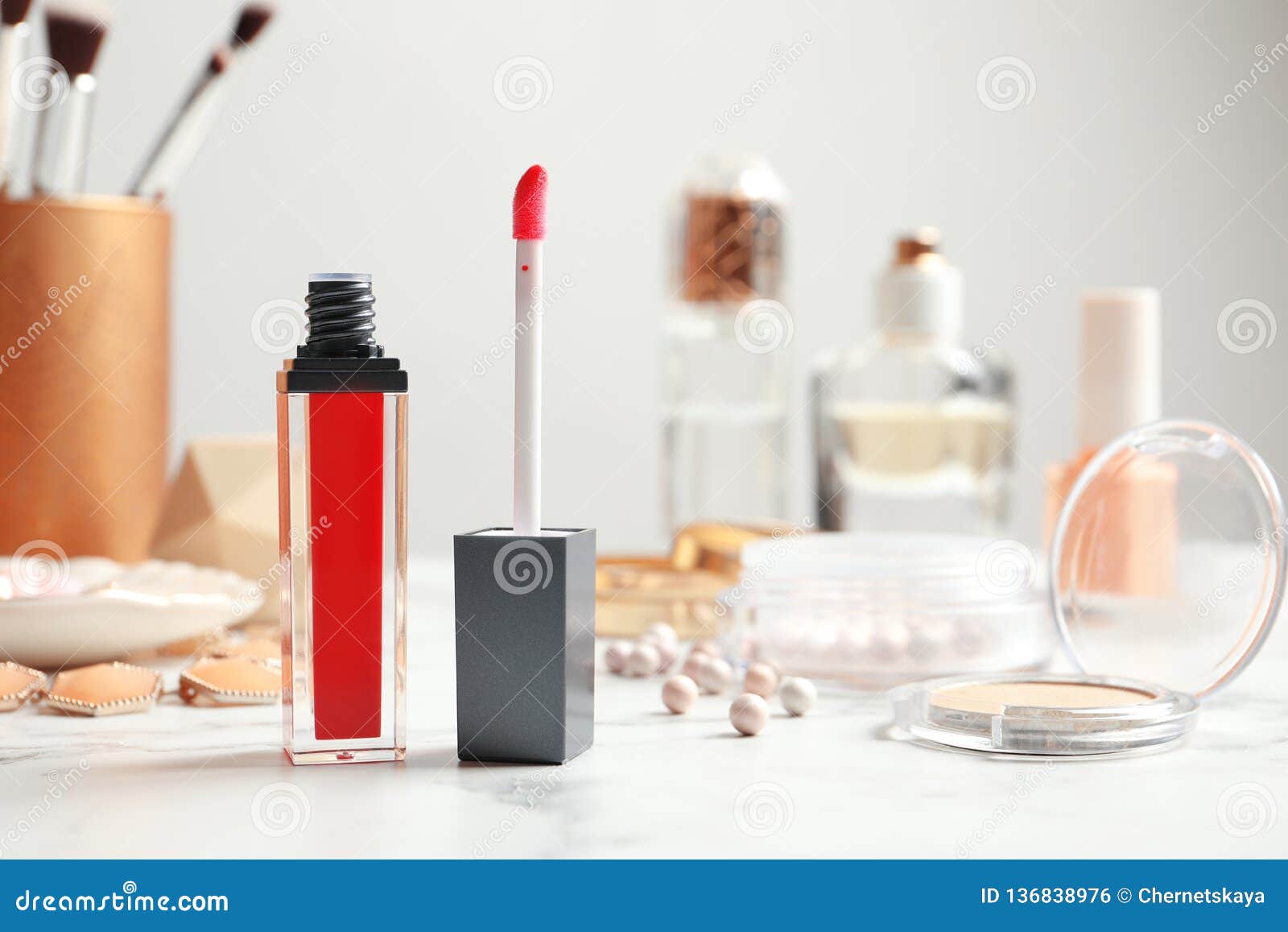 Liquid Lipstick with Applicator and Cosmetics. Space for Text Stock