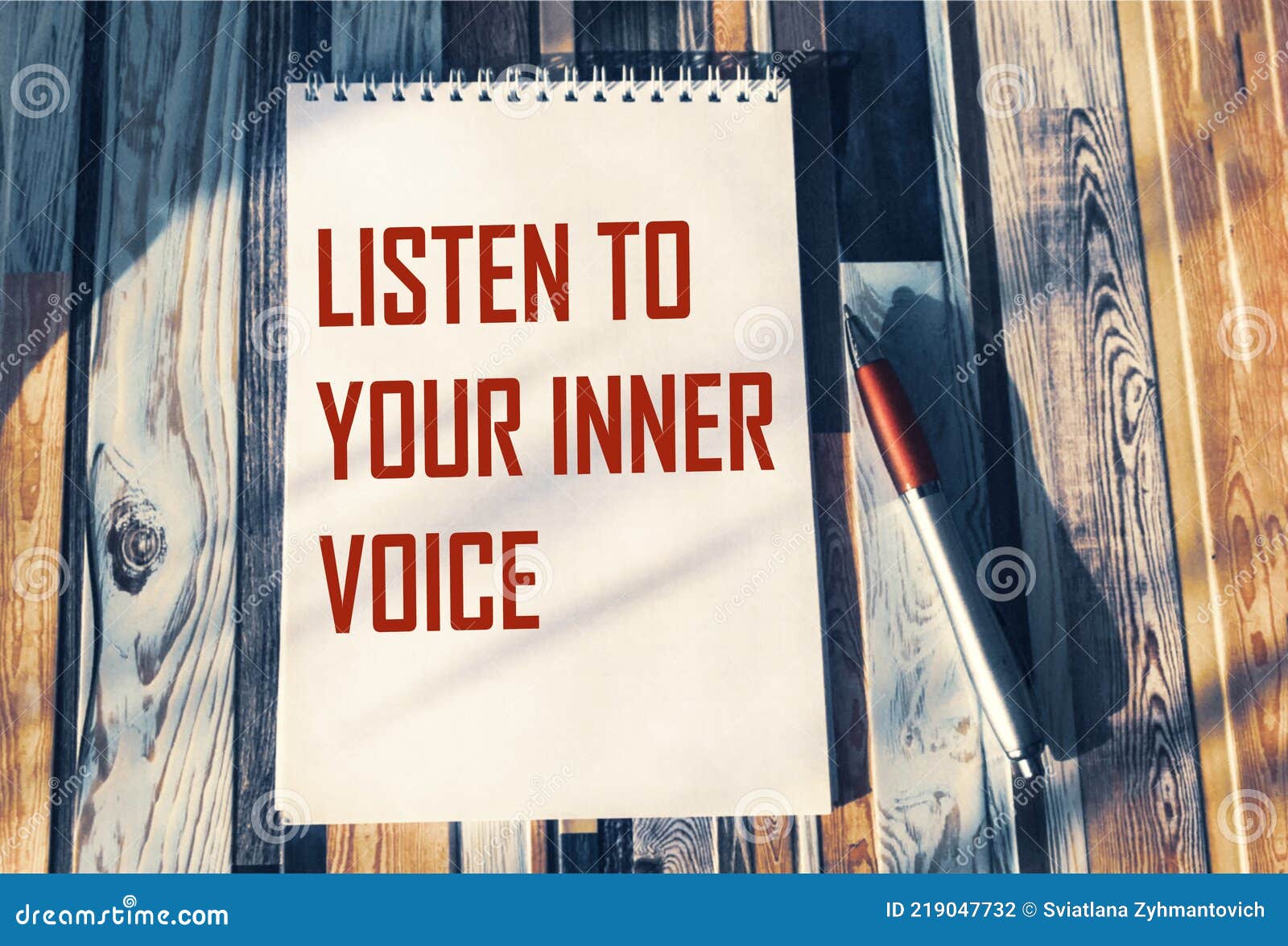 listen to your inner voice - inspiring phrase on a notebook. confidence, intuition