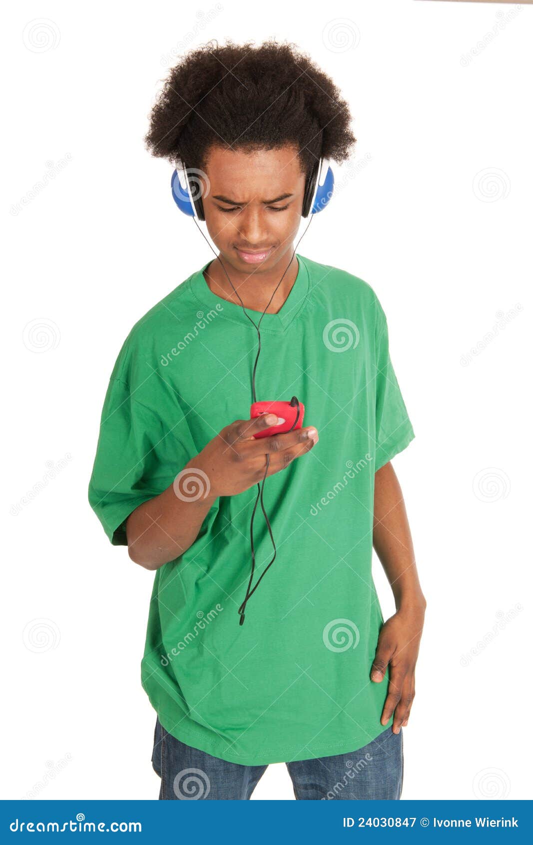 Listening music. Black boy is listening to music from his smart phone