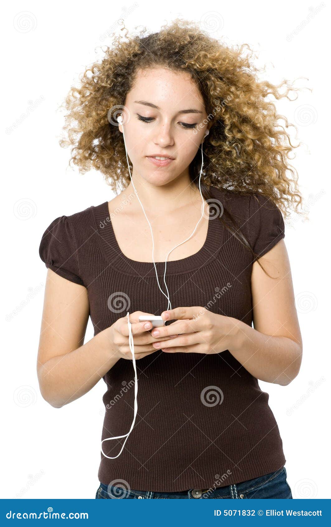 Listening to an MP3 player stock photo. Image of young 5071832