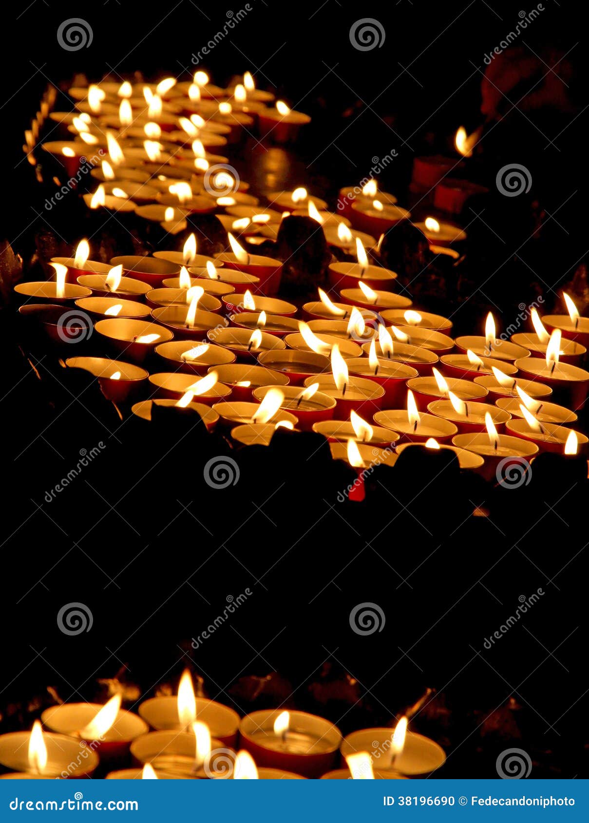 Lit Candles in a Church during the Funeral Celebration Stock Photo