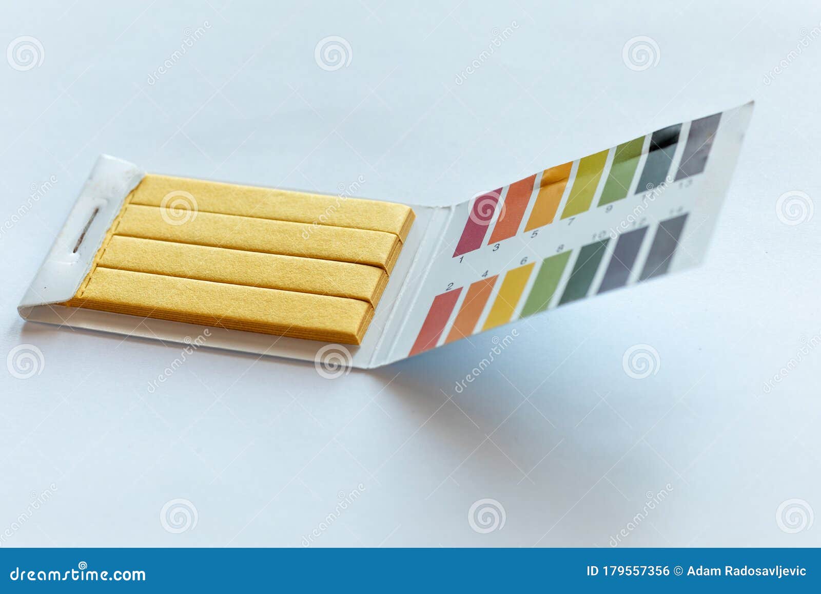 PH test with universal indicator paper - Stock Image - C033/2862