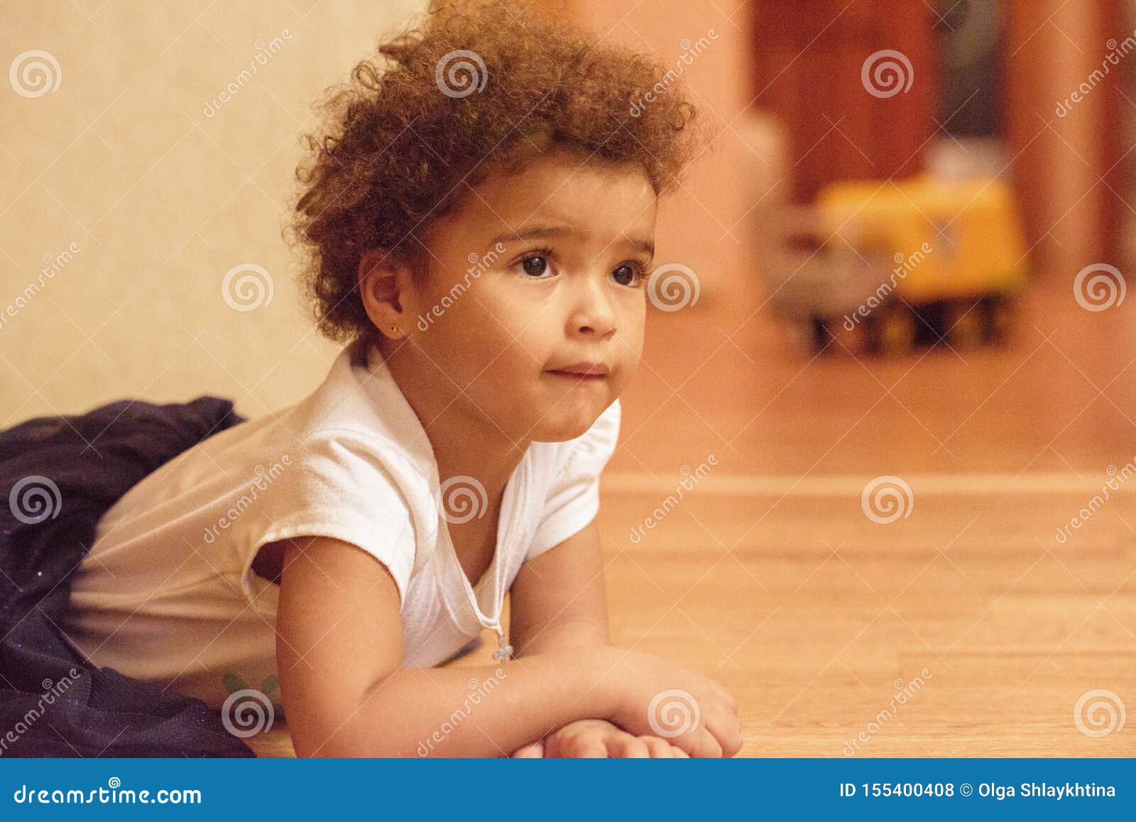 Little African American Cute Girl Laying On Floor With Smile Emotion On Face Isolated On White
