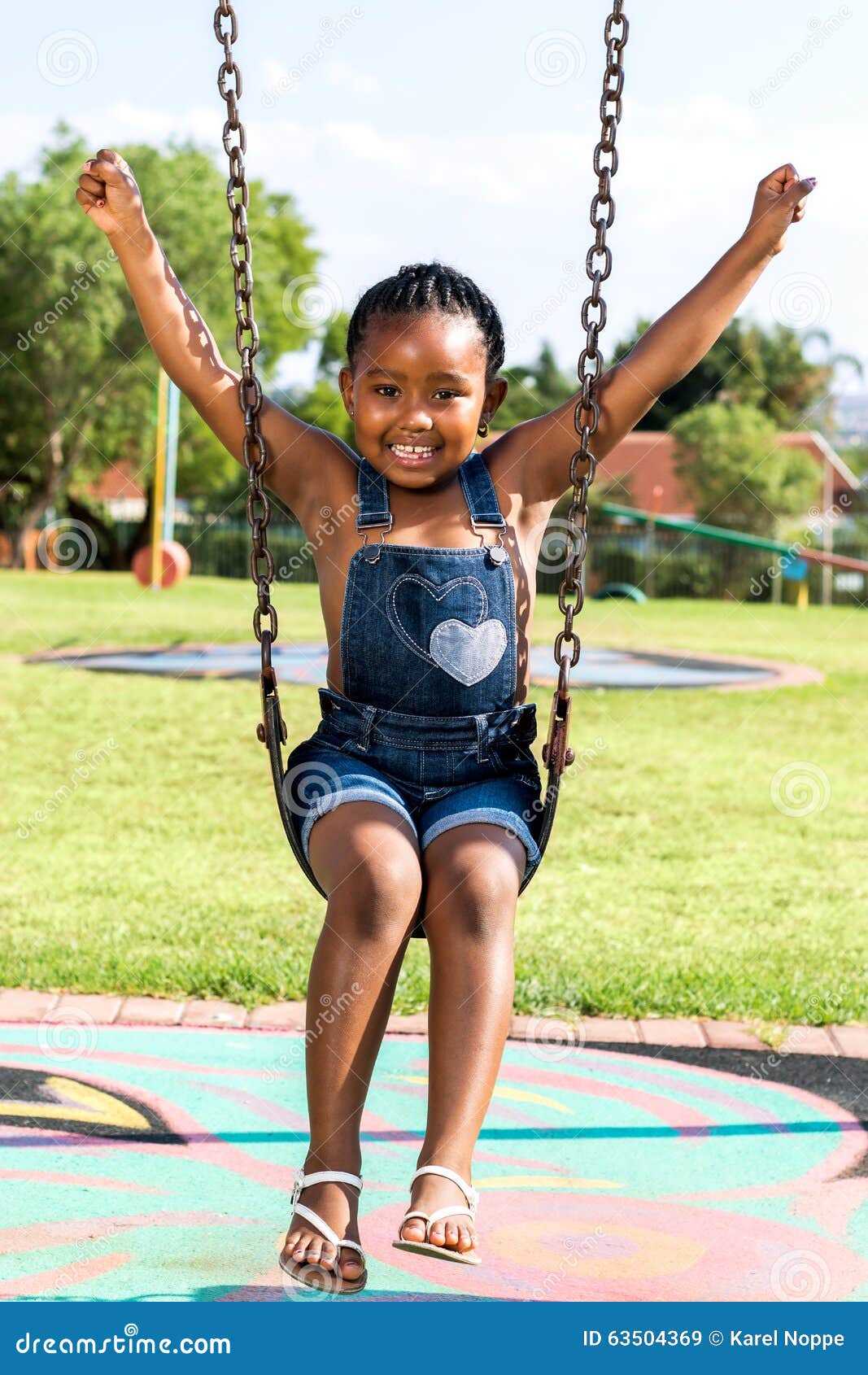 African kids playing on swing in neighborhood. Stock Photo by ©karelnoppe  64619673