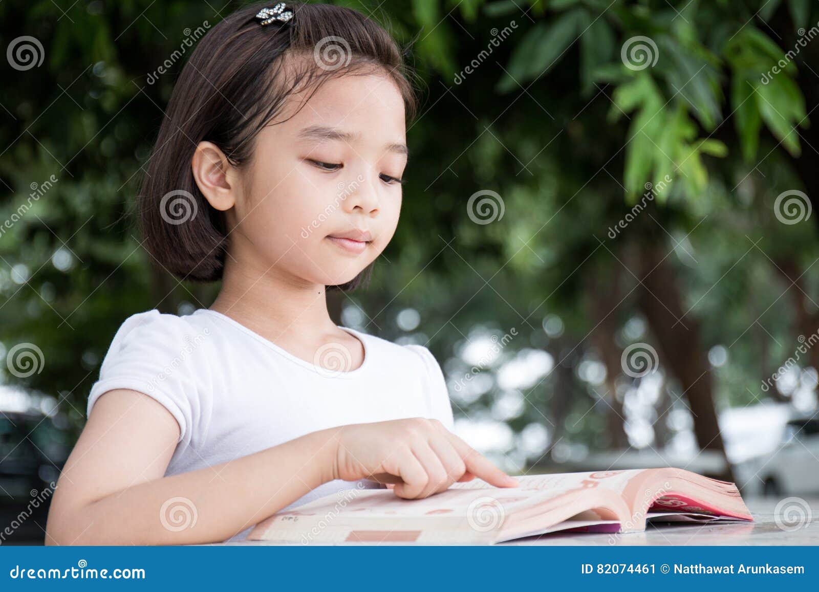 Little Asian Child Reading a Book Stock Image - Image of middle, lovely ...