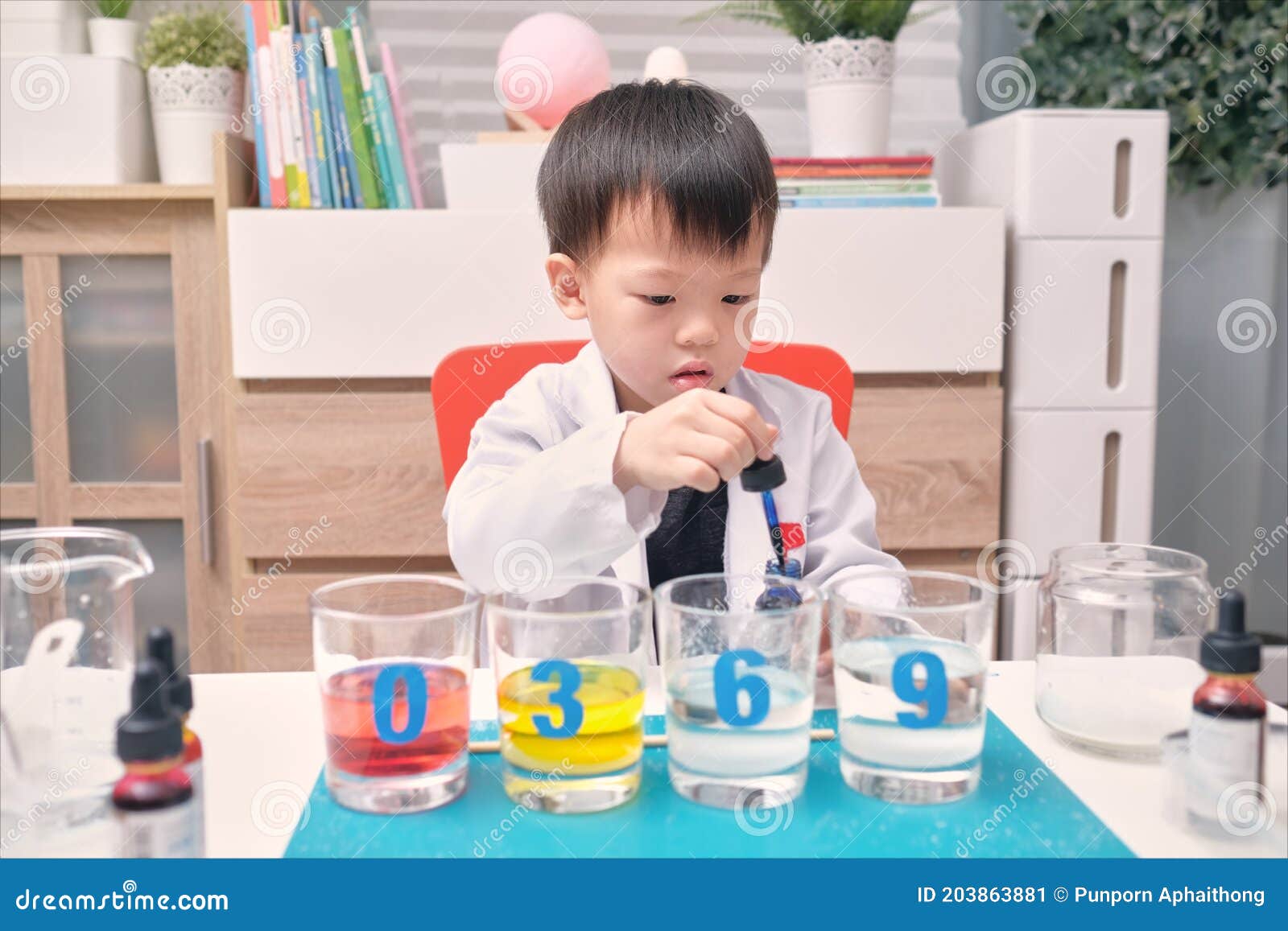 Little Asian Kindergarten Kid Studying Science, Making Sugar Water