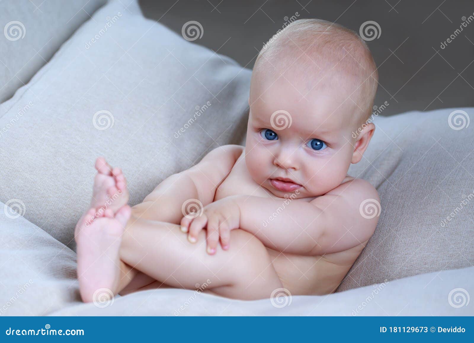 Little baby on the couch stock image. Image of white 181129673