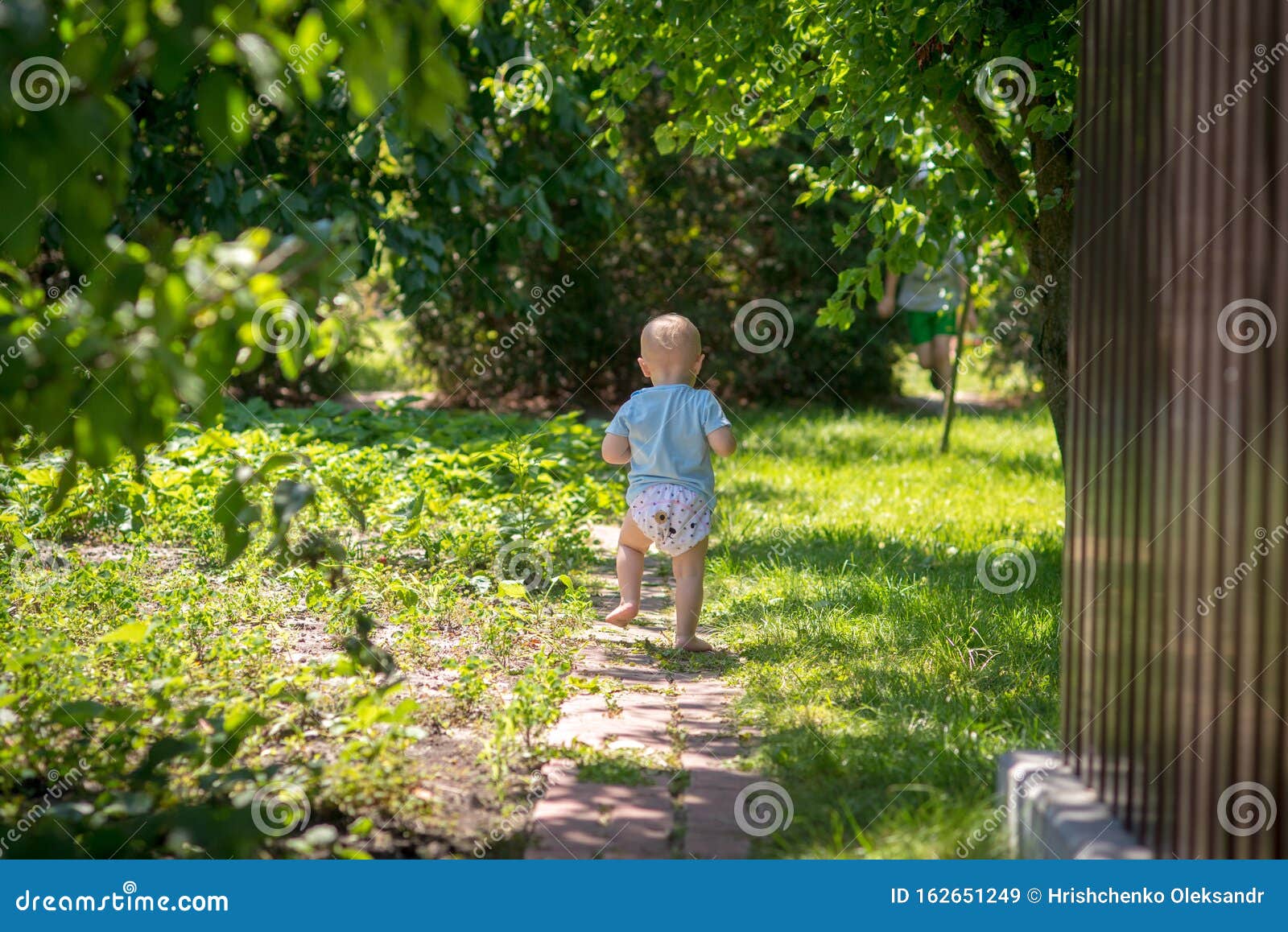 Little Baby in a Diaper in the Garden Stock Image Image of care